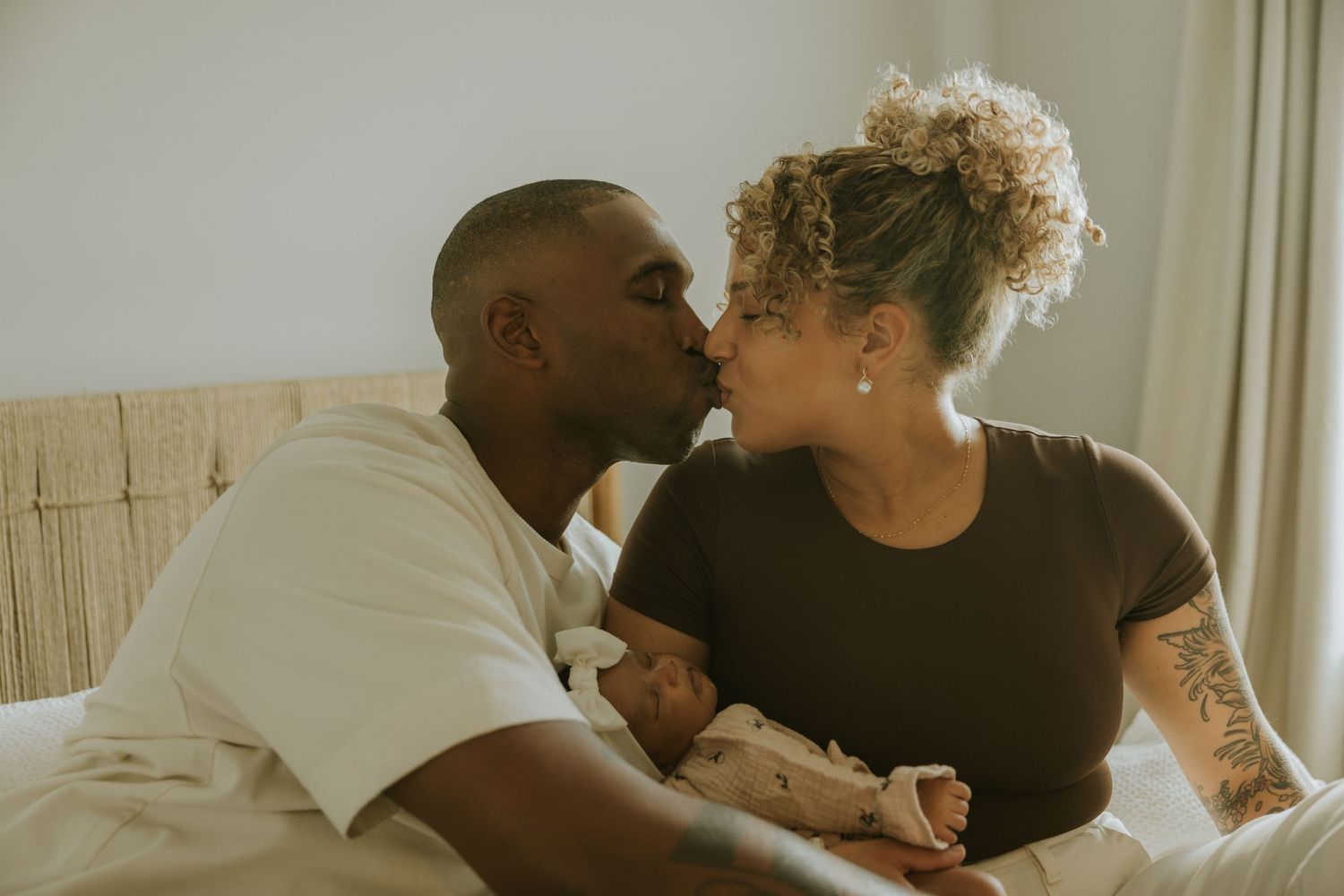 Quiet new-born home session capturing presence and emotion in natural light