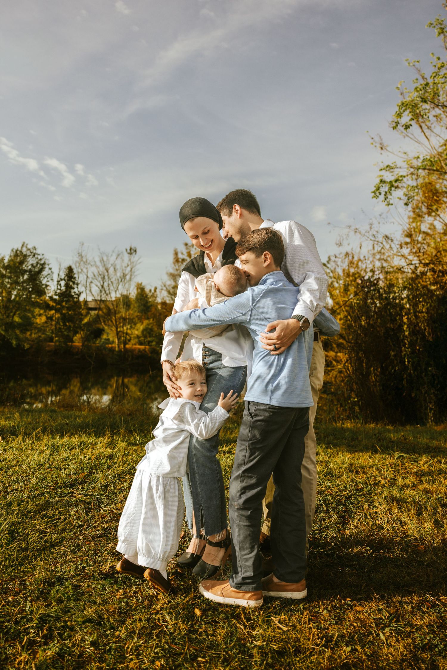 Candid outdoor family portrait captured in Augusta GA surrounded by natural light