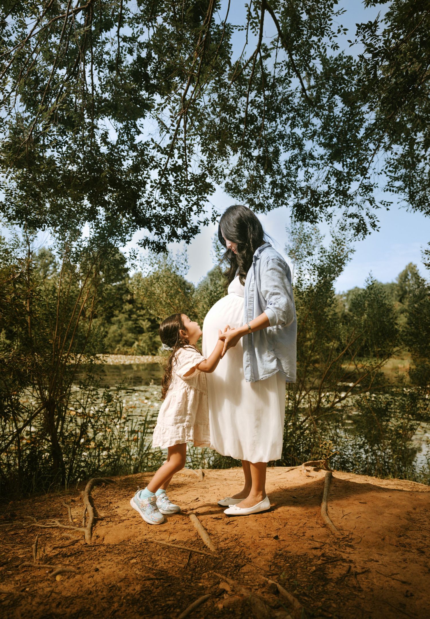 Documentary maternity session photography with a soft, cinematic tone
