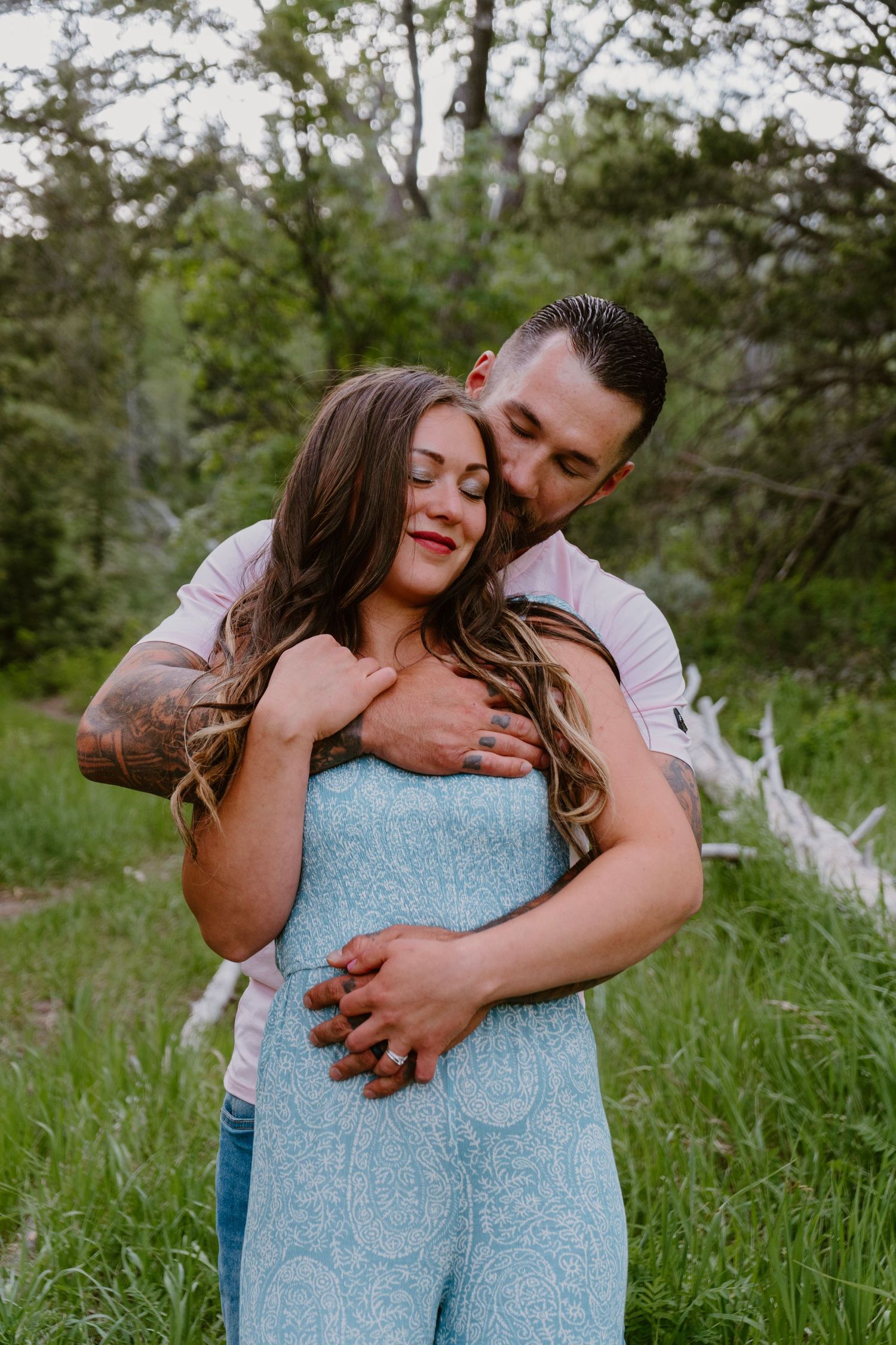 Couple embracing during romantic mountain photo session in Utah