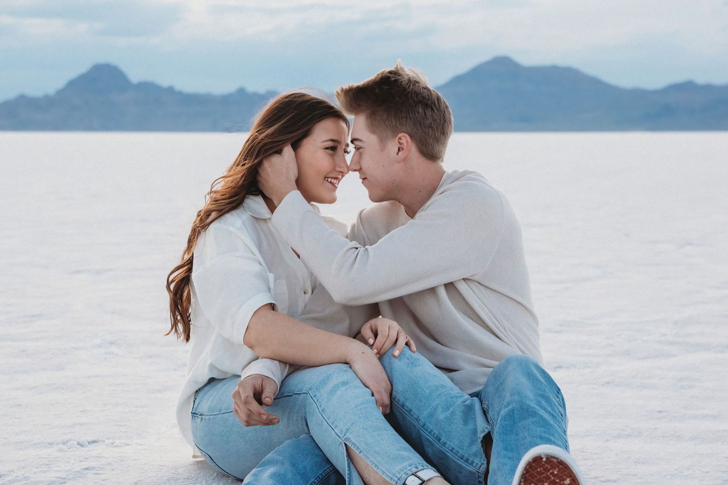 Romantic moment between couple at the Salt Flats during sunset session