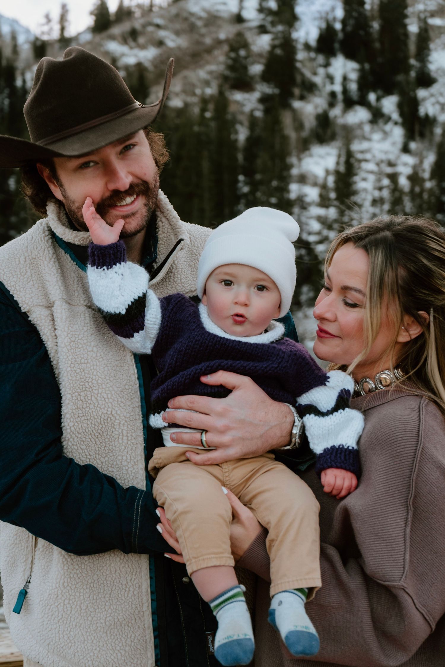 Mountain family session with parents holding baby during Utah outdoor photos