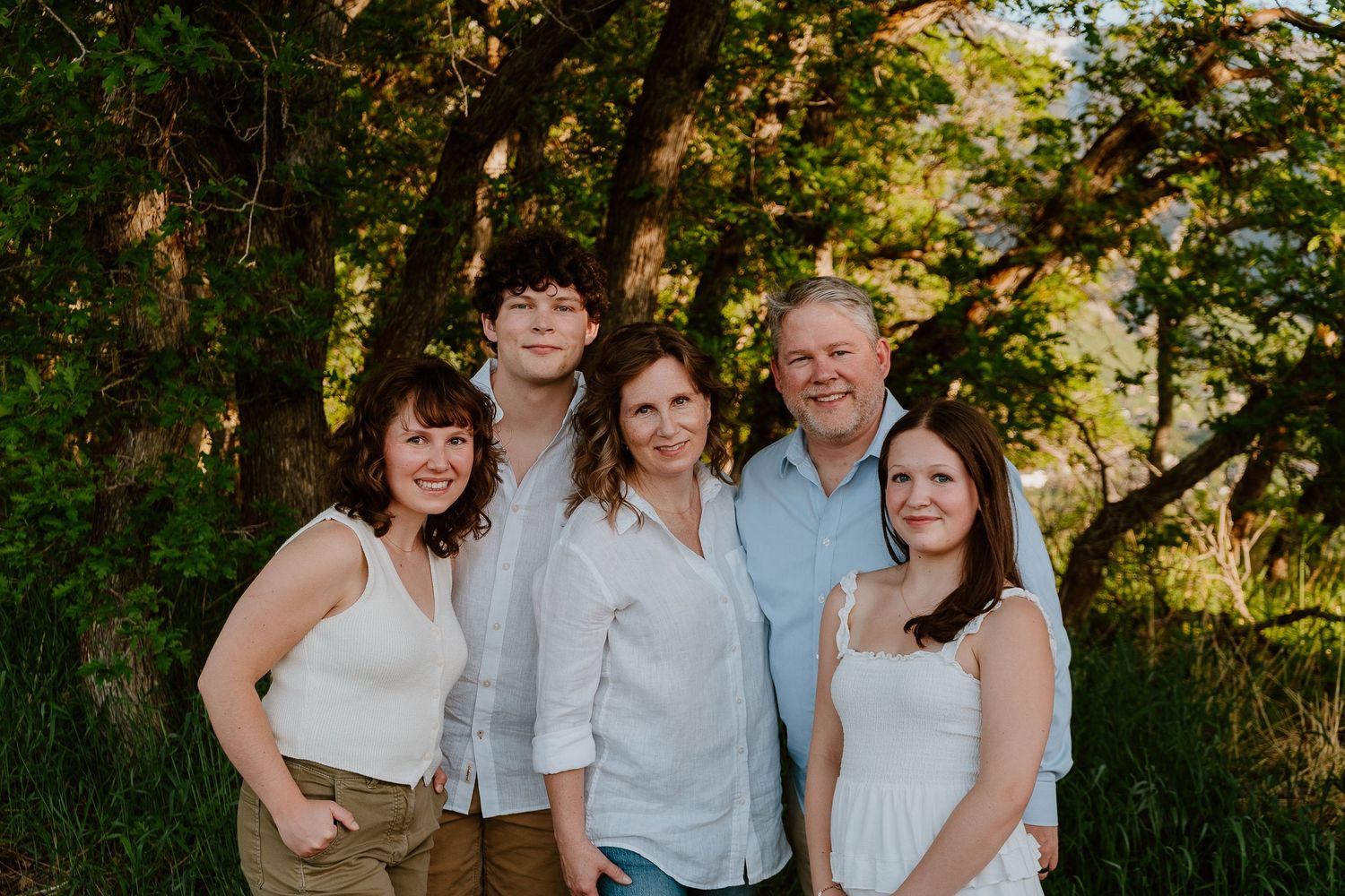 Extended family portrait outdoors with parents and grown children in Utah