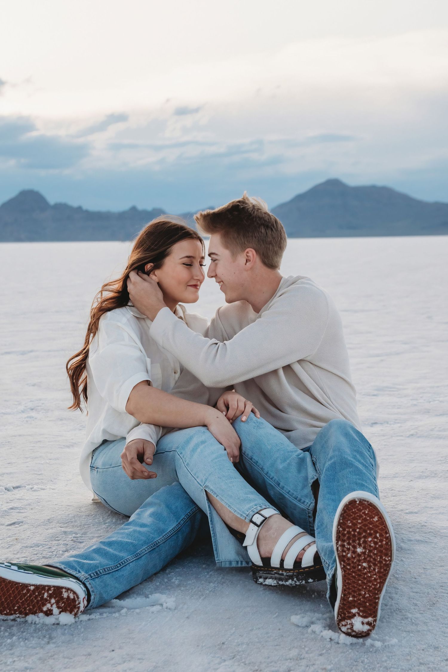 Romantic moment between couple at the Salt Flats during sunset session