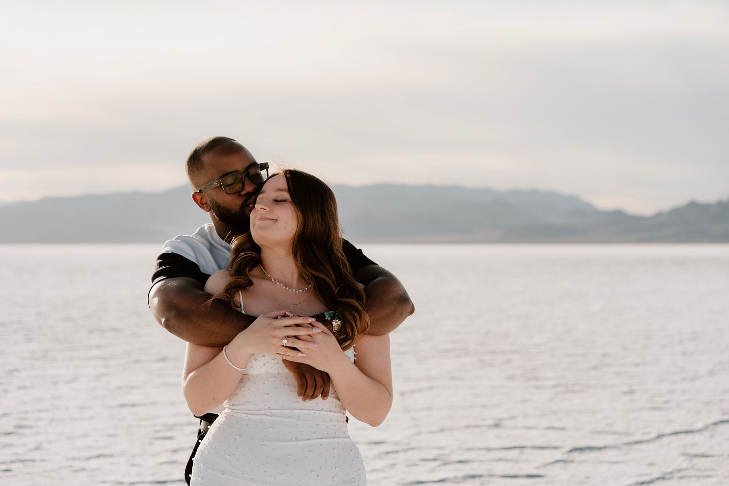 Couple embracing at Bonneville Salt Flats during romantic Utah session