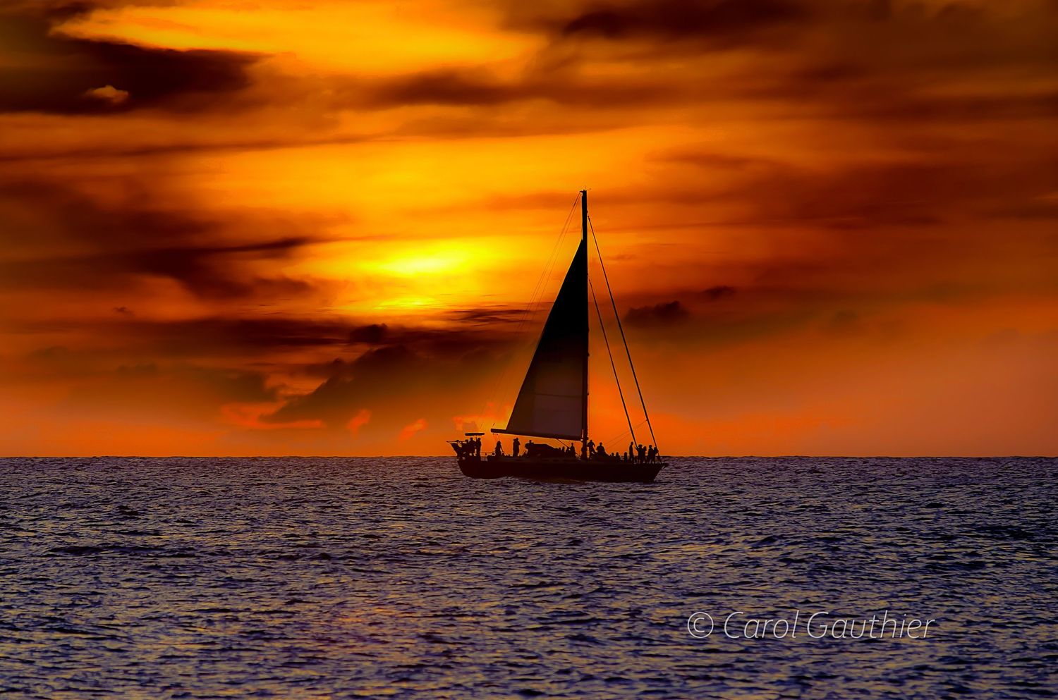 Sunset with sailboat in Hawaii