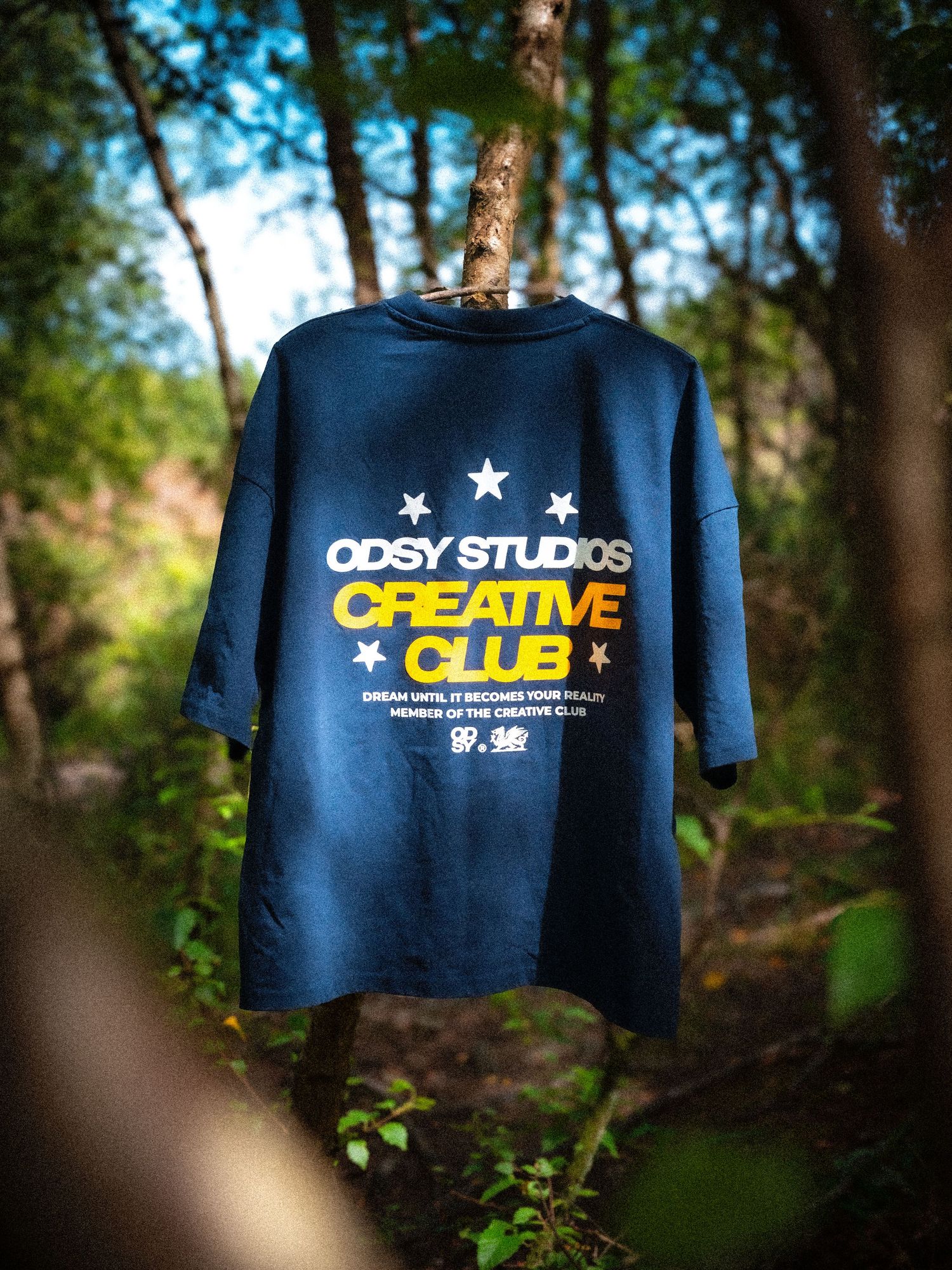 A dark blue t-shirt with a yellow and white graphic that reads 