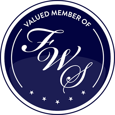 Navy blue circular badge reading Valued Member of FWS with decorative script lettering and stars.