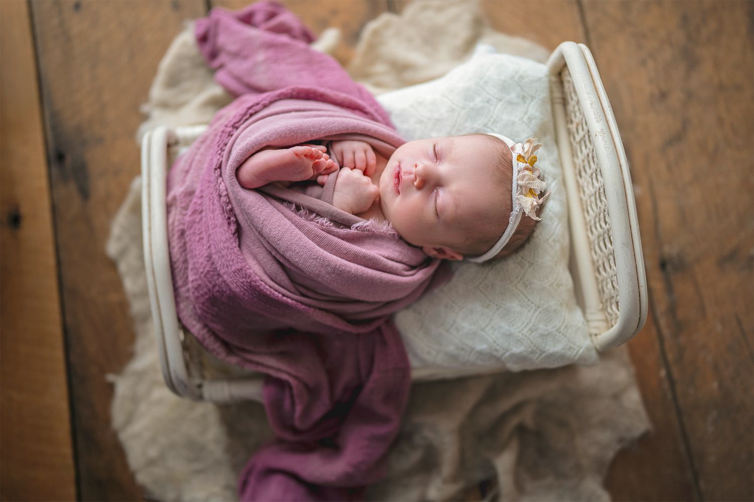 In studio Hillcrest North Shore, Newborn baby girl wrapped in pink and posed in a vintage bed – newborn photography Hillcrest, North Shore A
