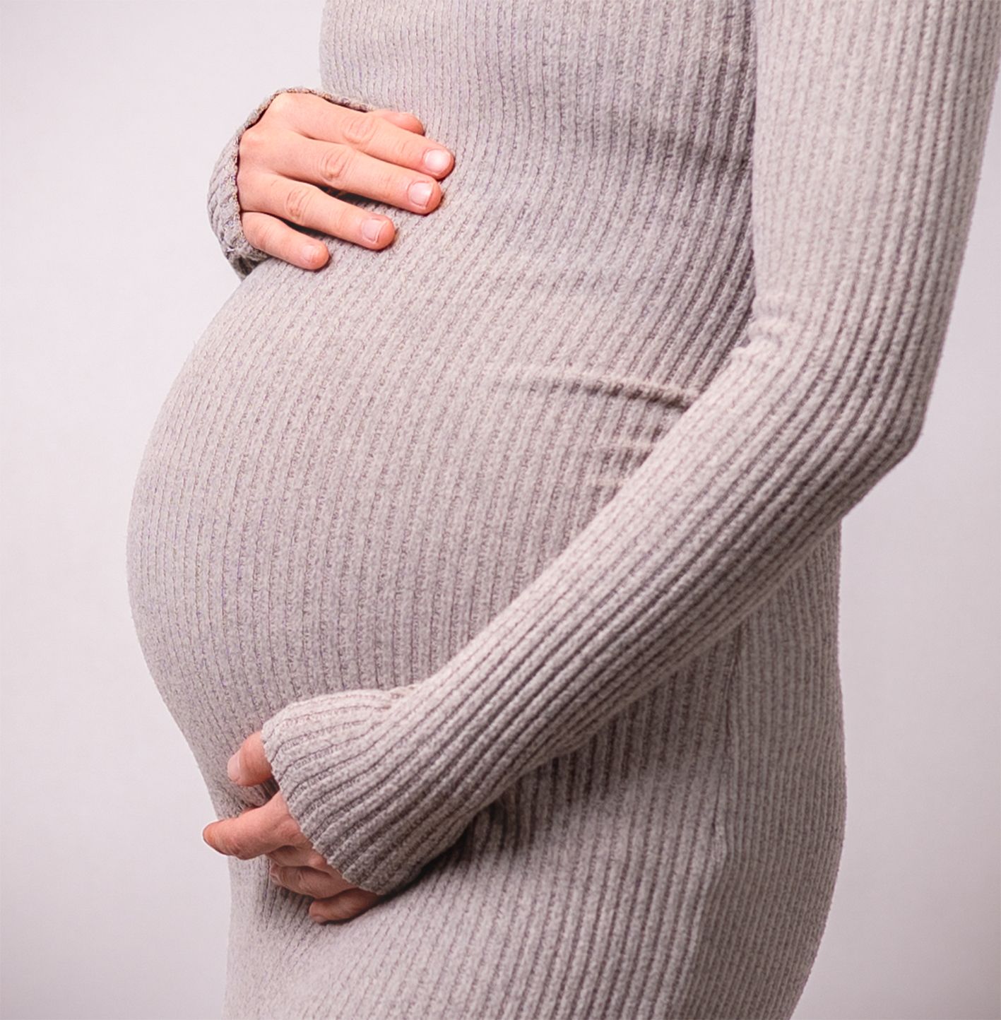 In studio Hillcrest North Shore, Close-up maternity portrait showing pregnant belly – Auckland maternity photography