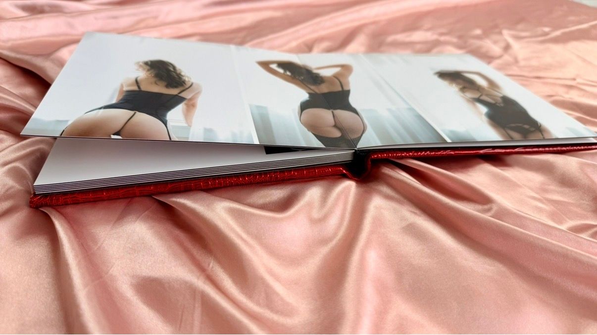 Open photo album displaying classic boudoir photography in downtown Colorado Springs.