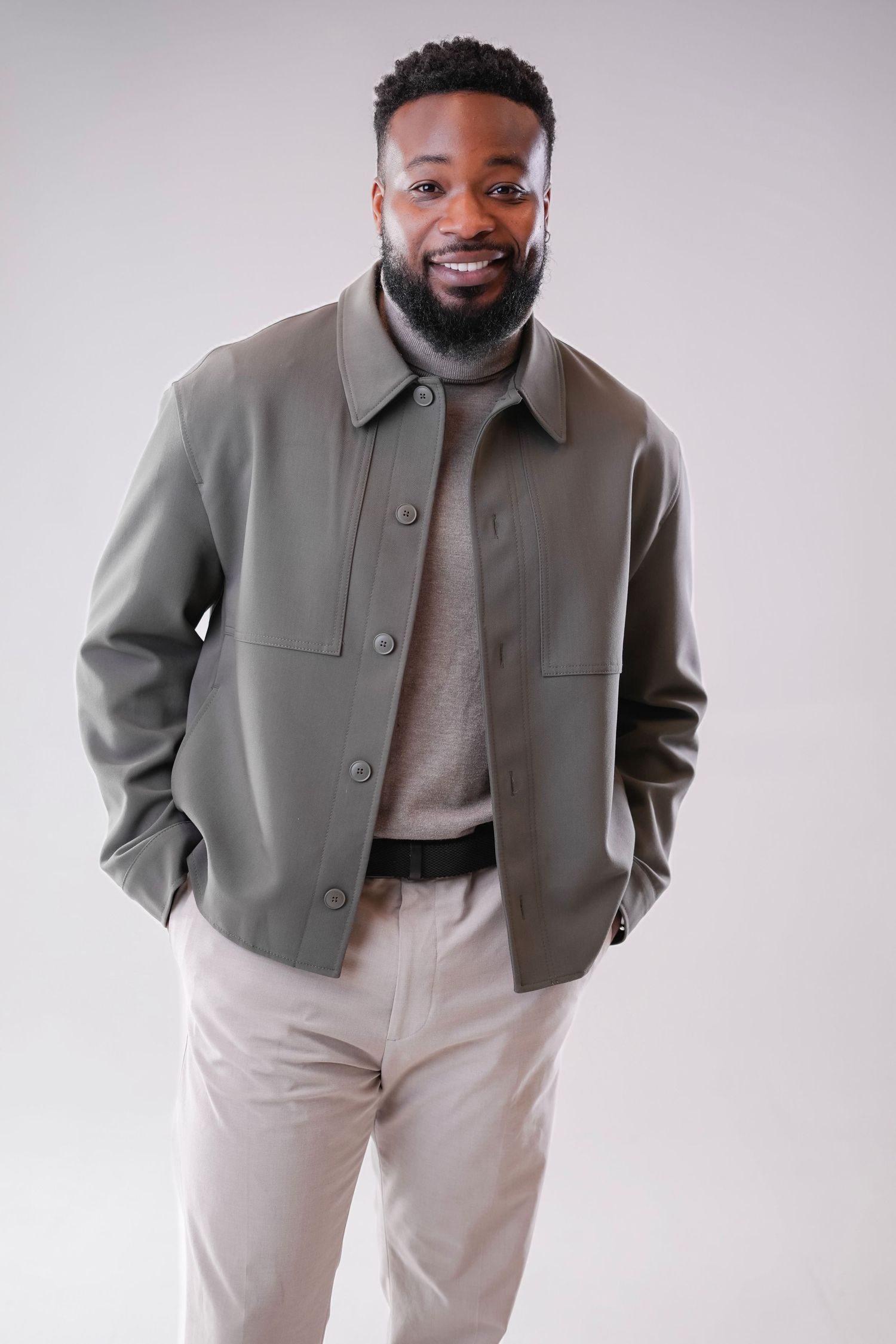Stylish grey jacket paired with cream colored pants shown from multiple angles in a fashion product photo series.