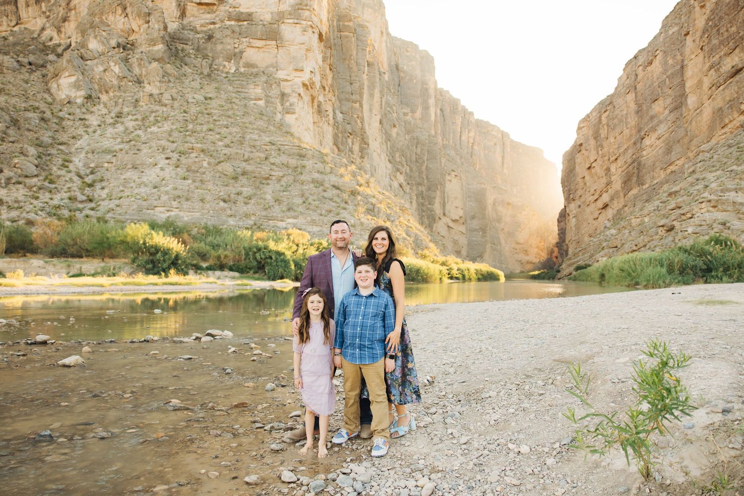 People exploring scenic Santa Elena Canyon in Big Bend National Park with towering limestone cliffs and river views.