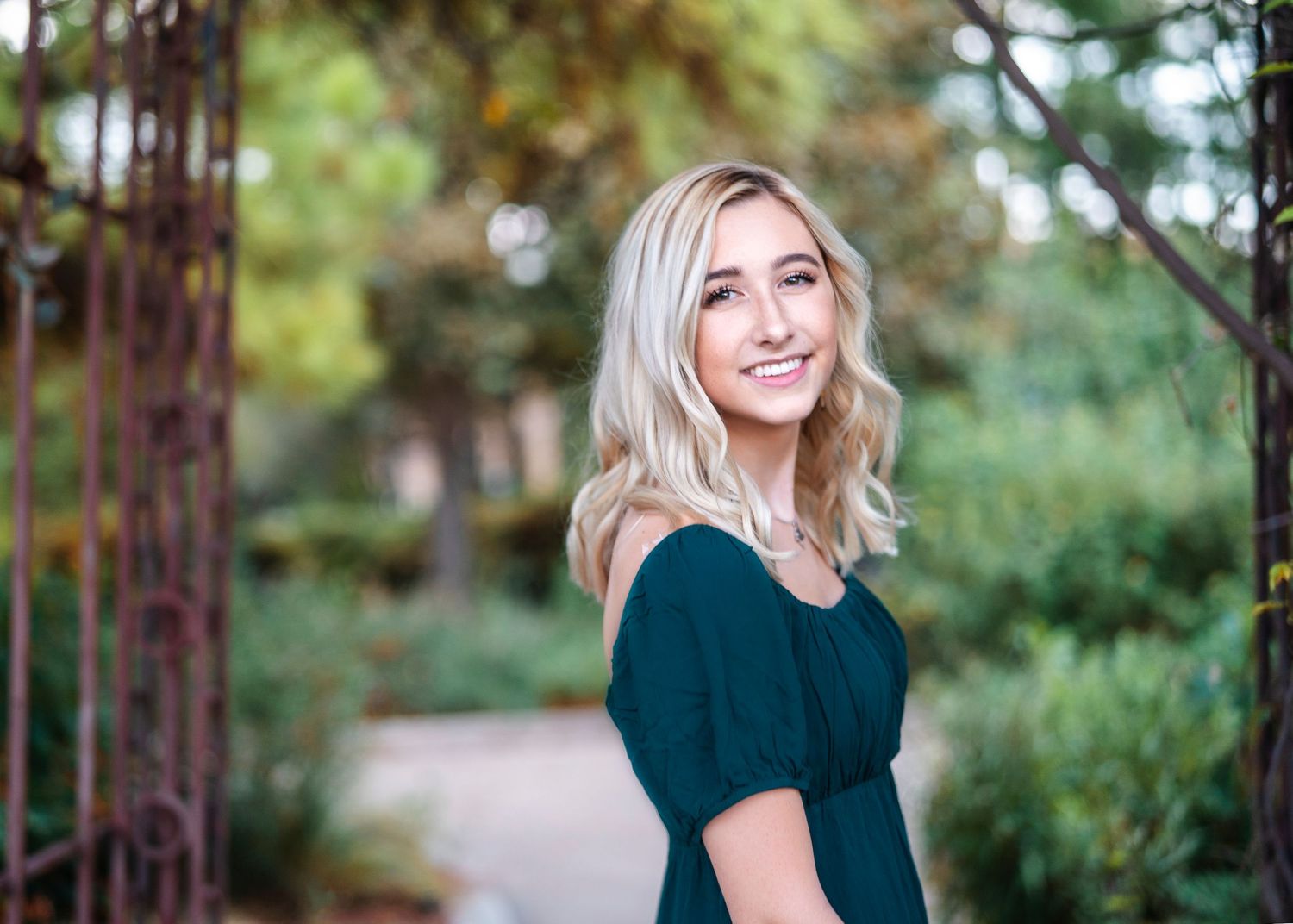 A series of natural outdoor portraits in a dark top with autumn scenery.