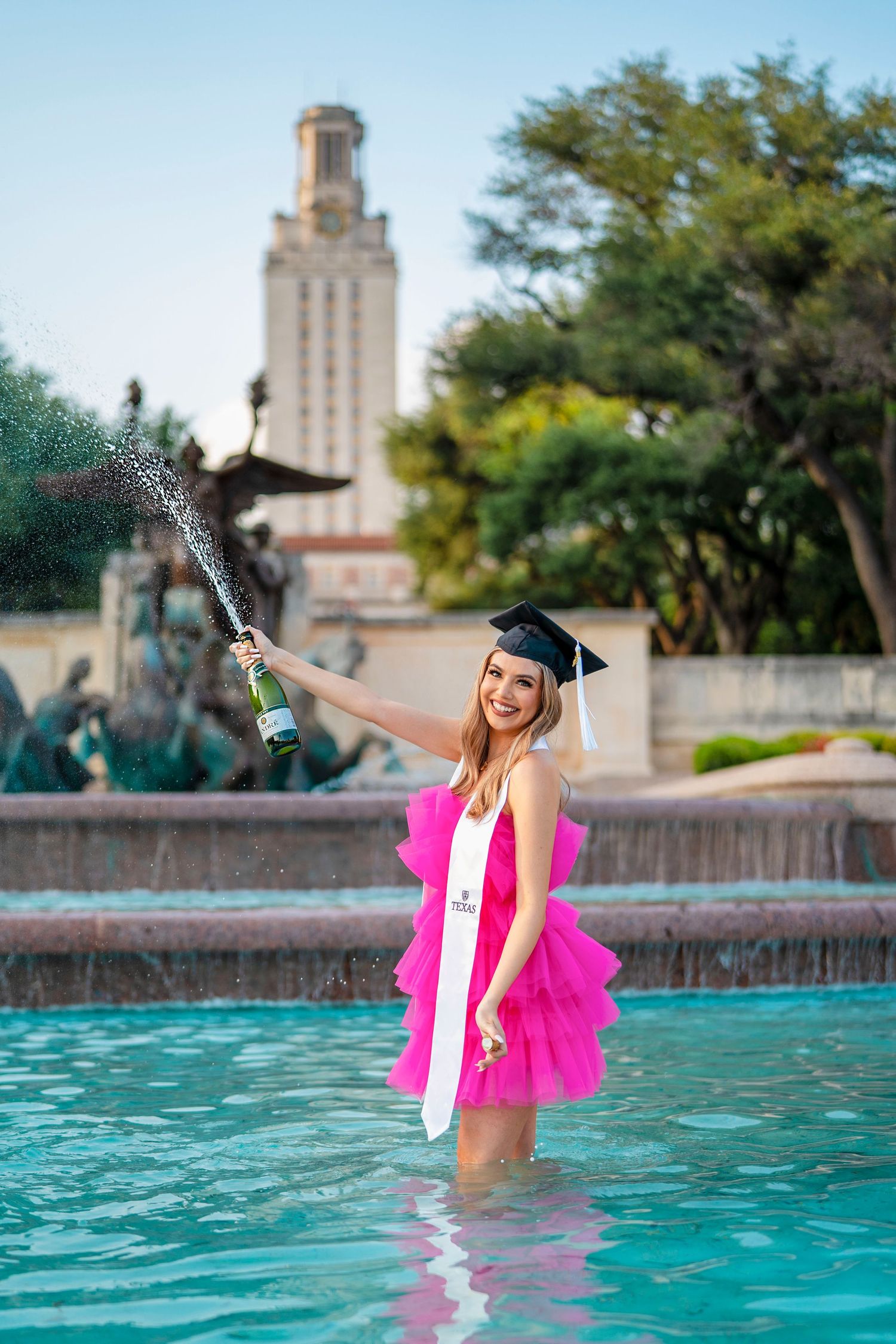 UT Austin senior champagne celebration photo at Littlefield Fountain