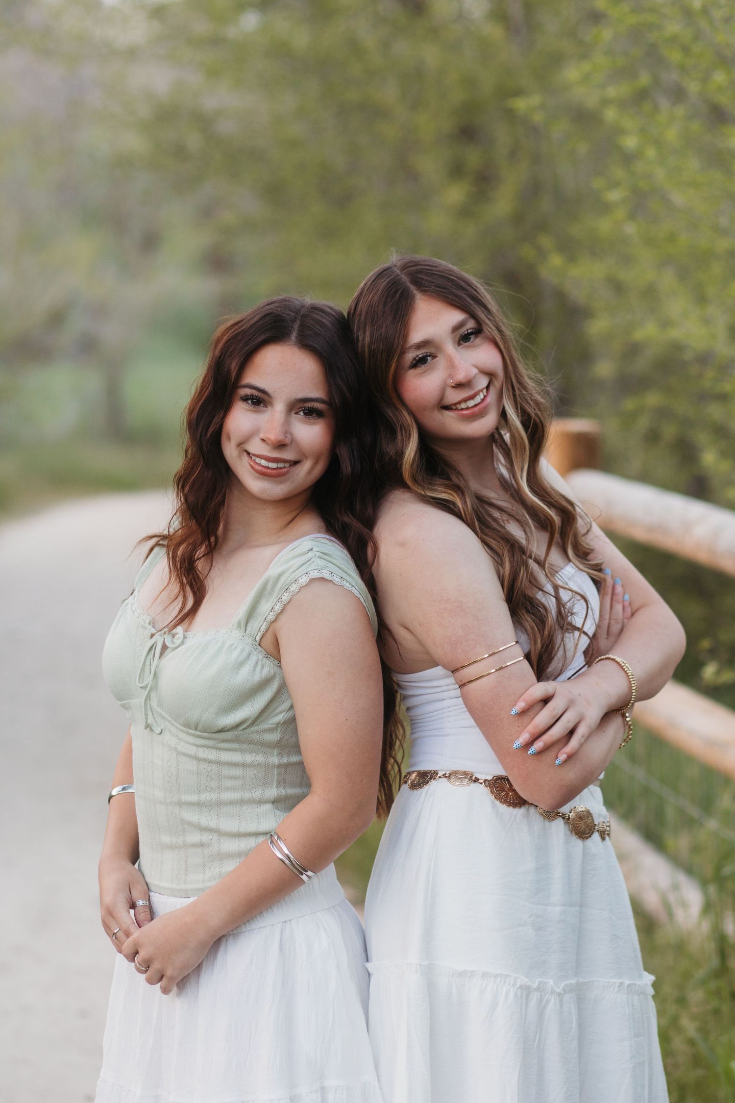 High school senior posing naturally in a field with soft light in Boise Idaho