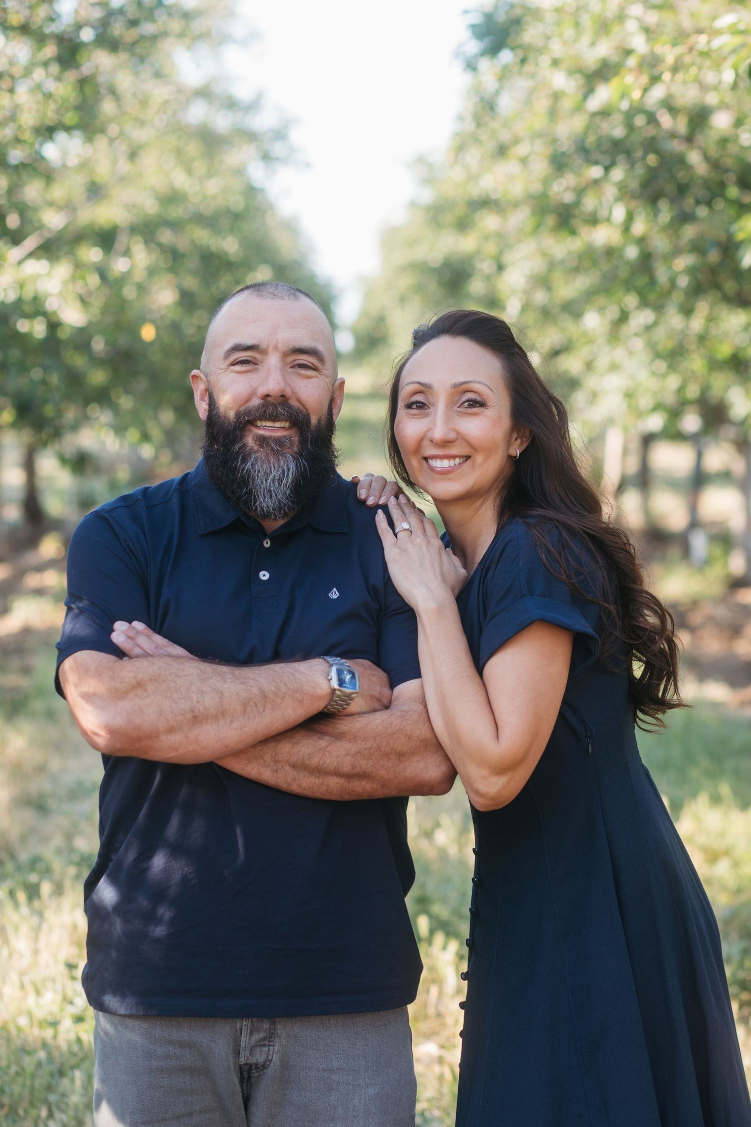 Parents smiling together during a late spring outdoor family session in Boise.