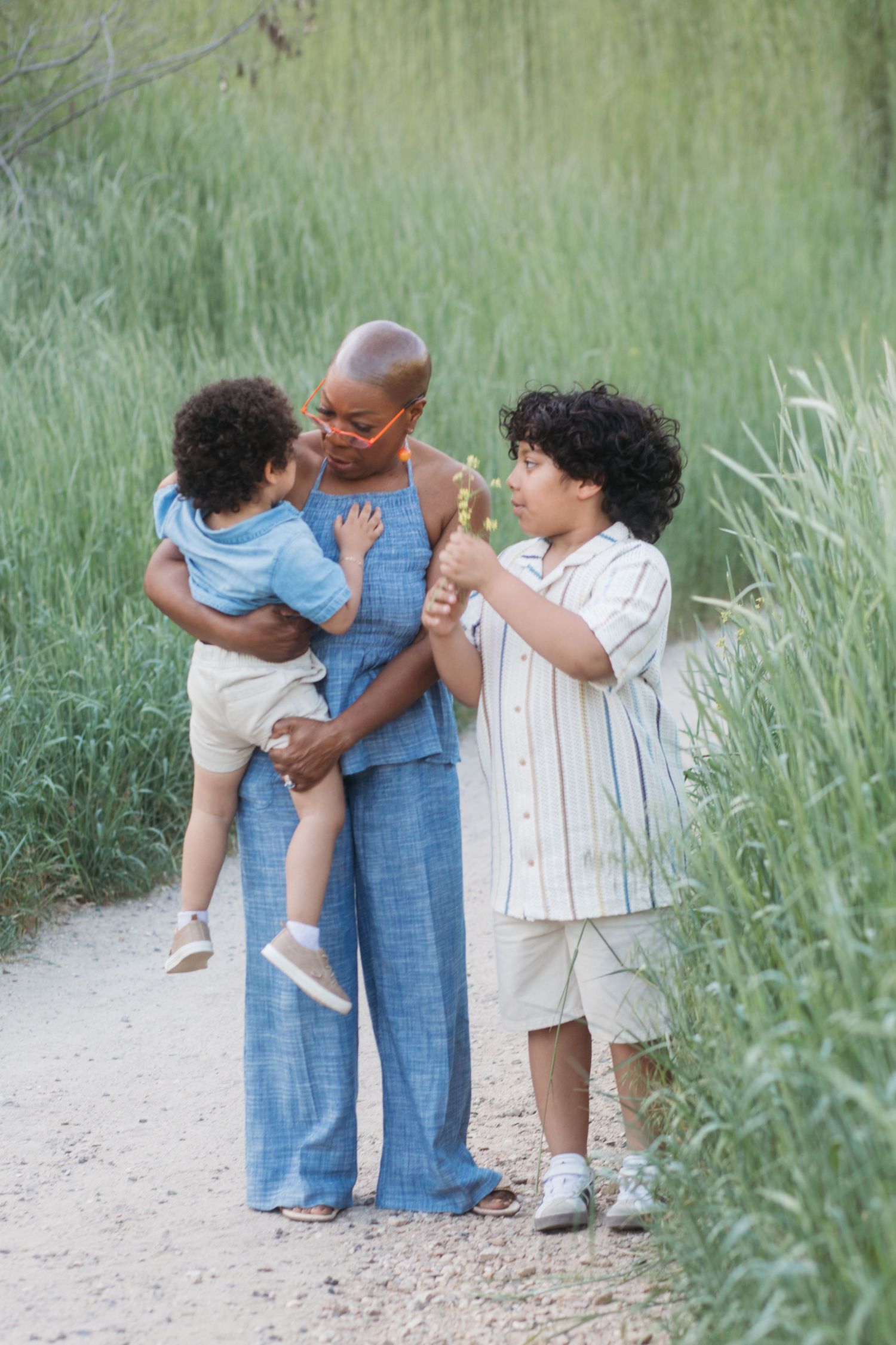 Grandmother sharing a joyful moment with grandchildren during a spring family photography session in Boise.