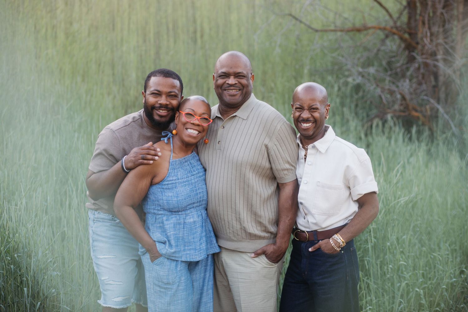 Parents and adult children sharing a candid moment during a spring family session at Camel’s Back Park.