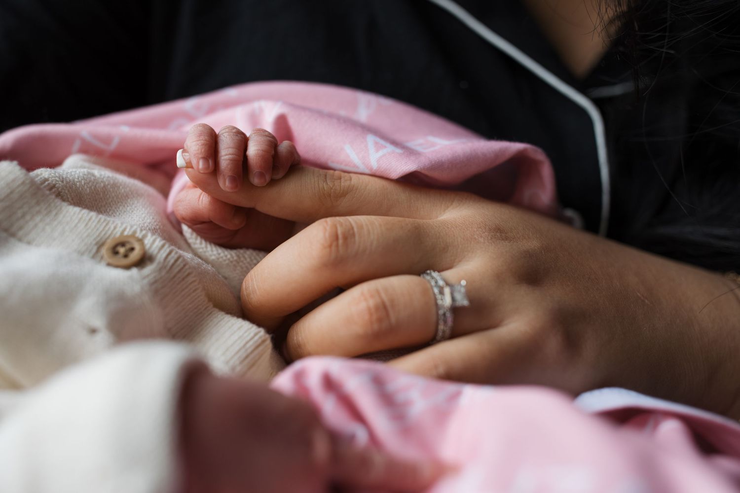 Close up of a newborn’s tiny hands during a Fresh 48 session in the hospital