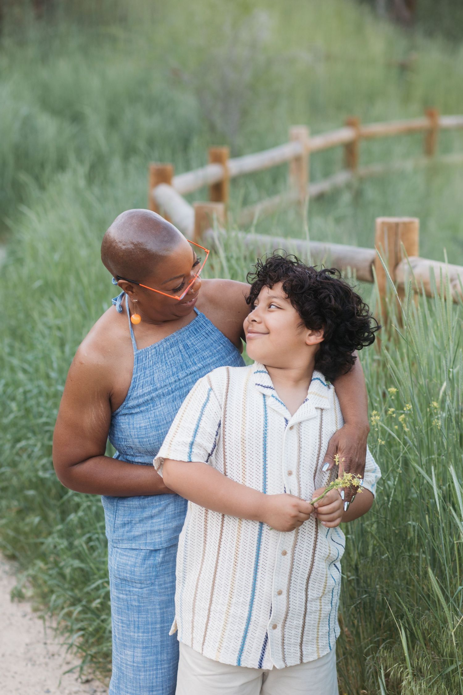 Candid portrait of grandmother and grandson sharing a sweet moment outdoors at Camel’s Back Park.