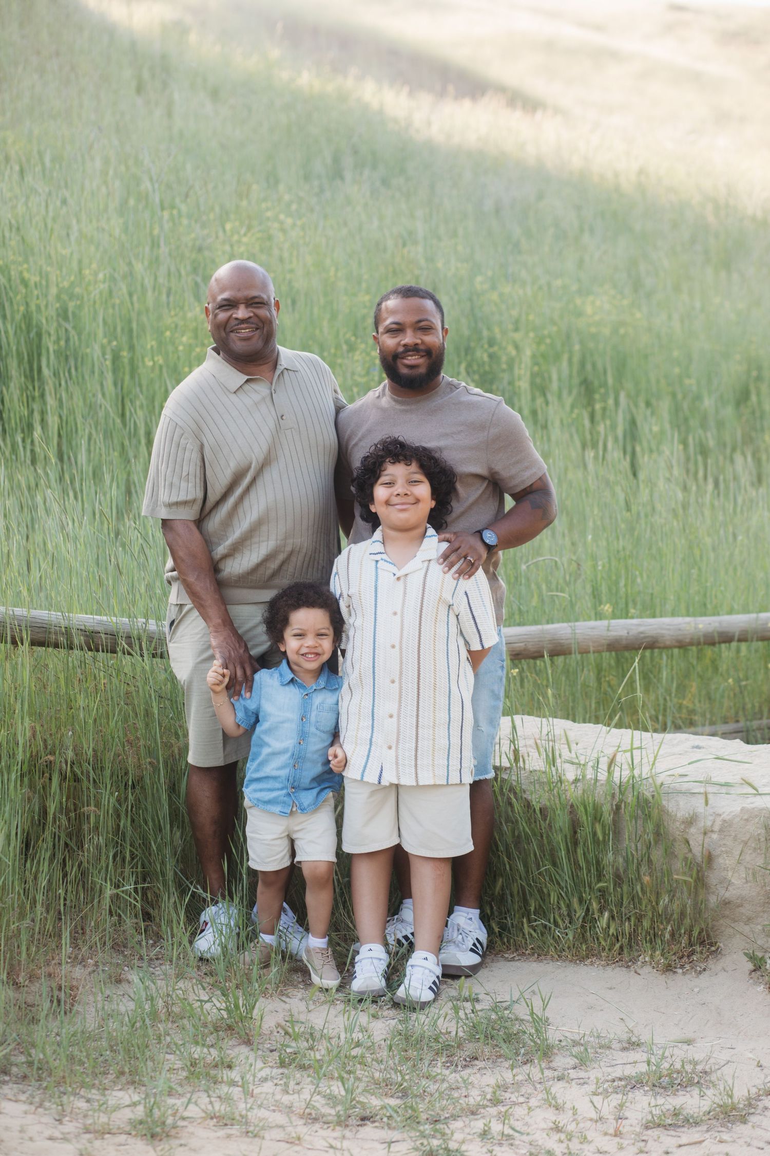 Three generations posing together outdoors at Camel’s Back Park in Boise during an extended family session.