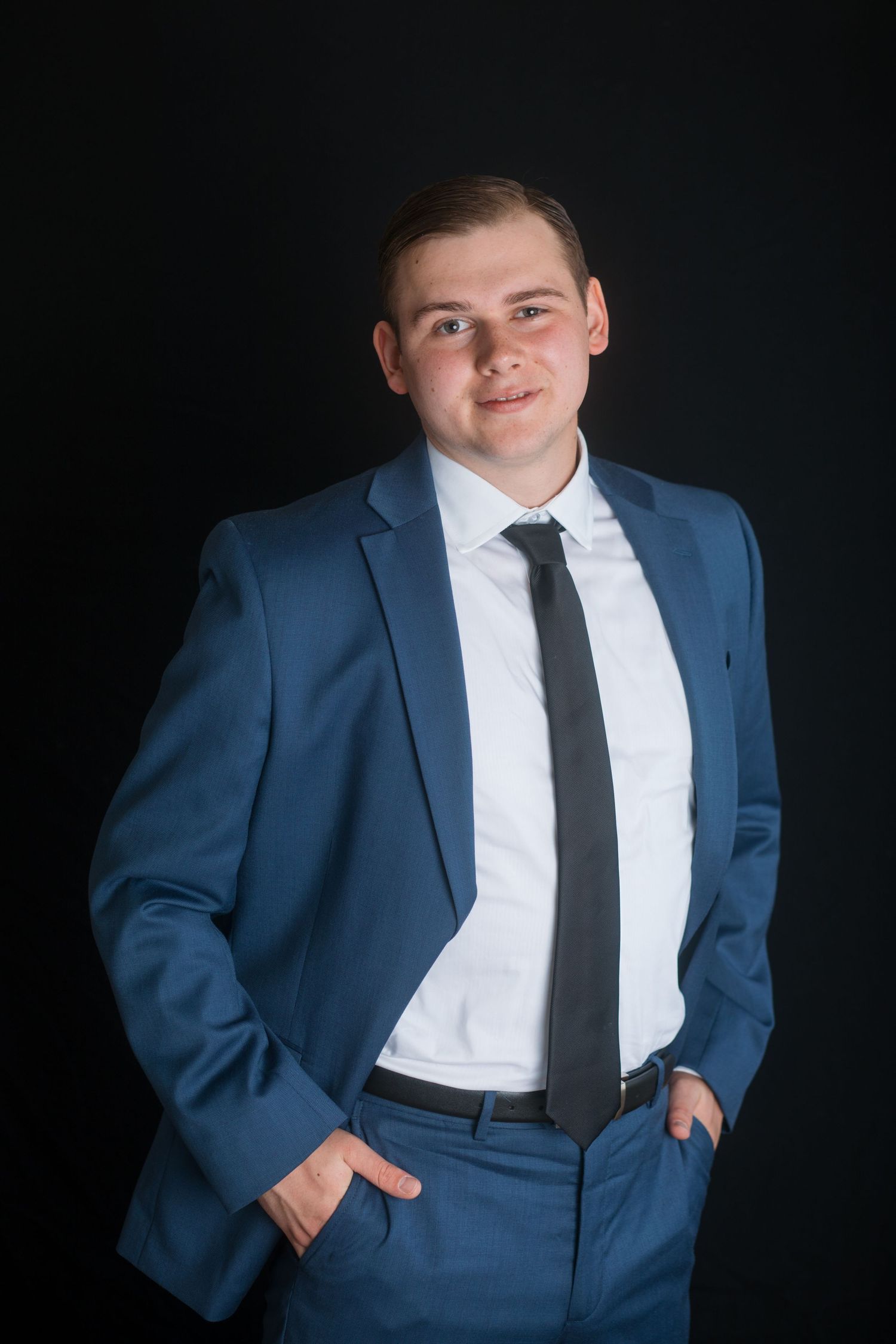 Relaxed male headshot in blue suit with casual pose, Boise Idaho photographer