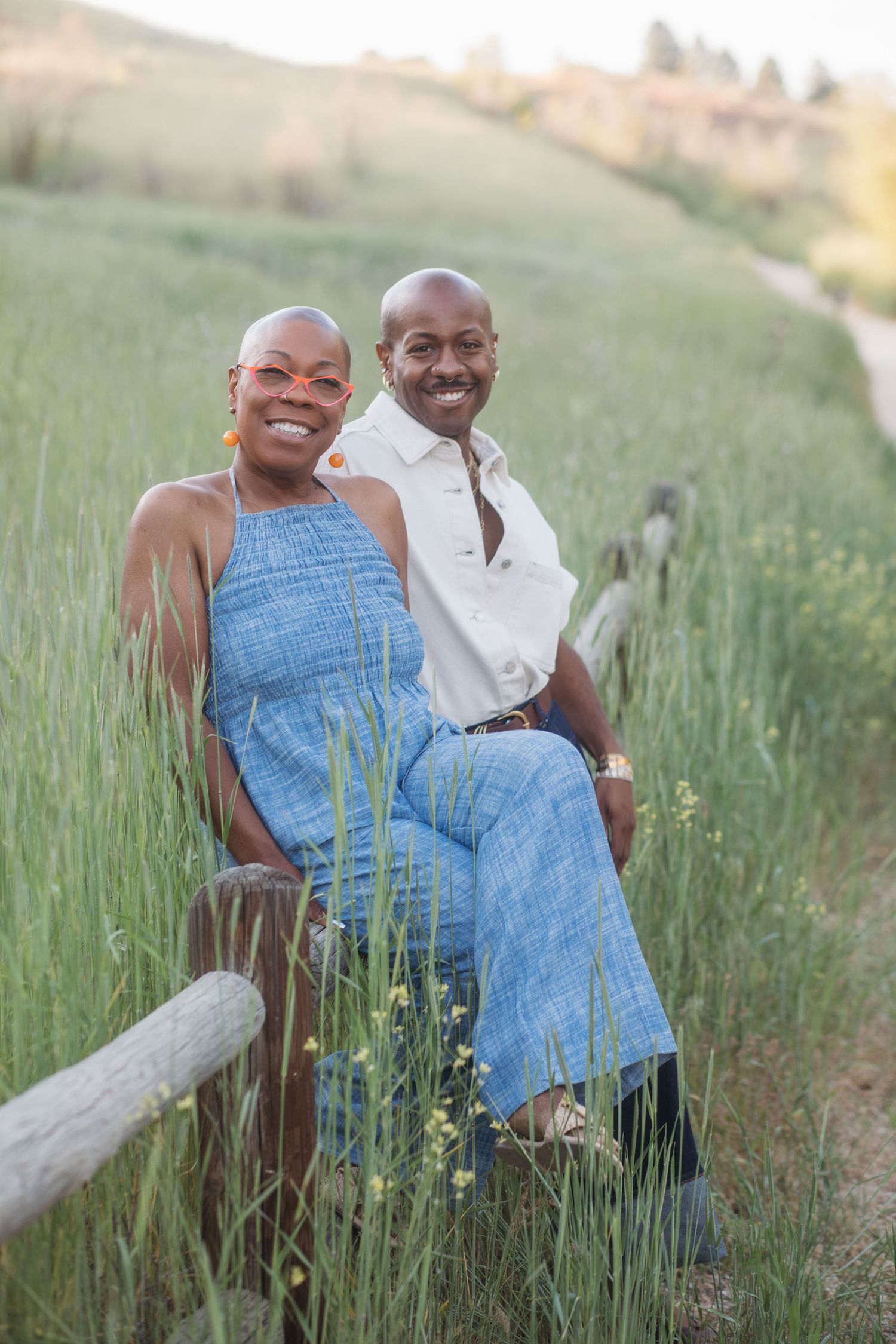 Mother and adult son sitting together during a spring extended family photography session at Camel’s Back Park in Boise.