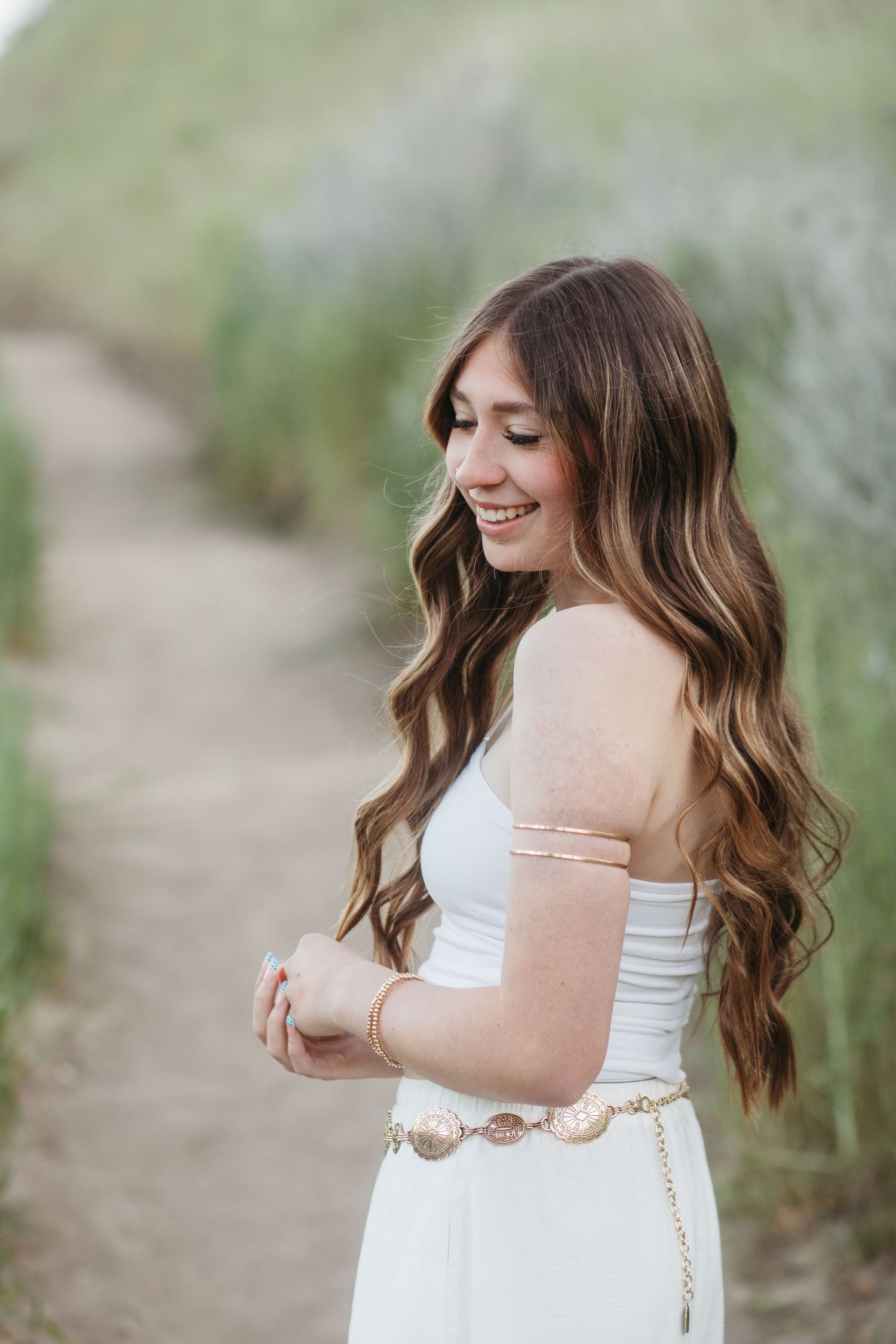 High school senior smiling in soft light during Boise senior portrait session