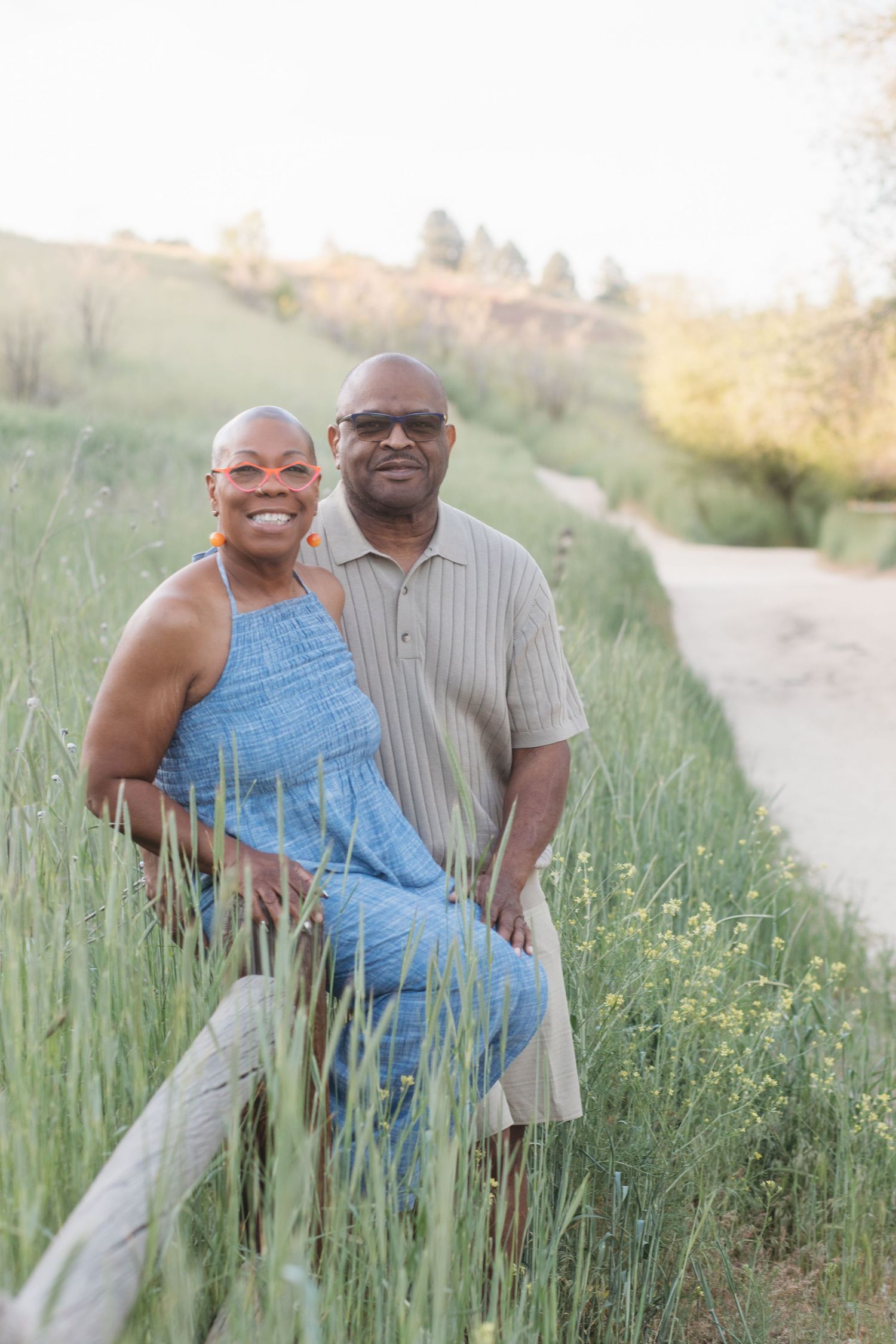 Husband and wife posing together in the Boise foothills during an extended family session at Camel’s Back Park.