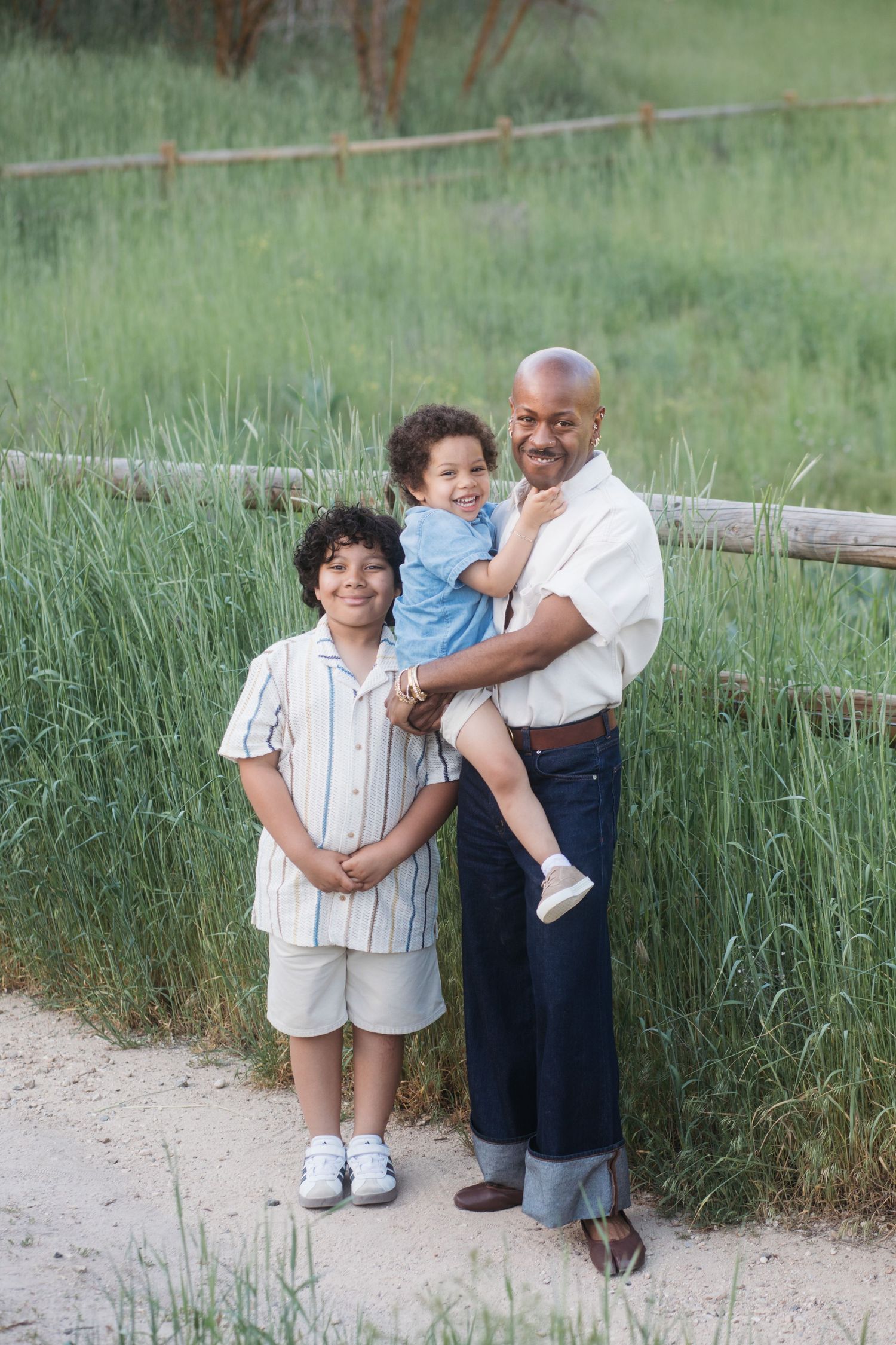 Uncle posing with grandchildren outdoors at Camel’s Back Park during a Boise family session.