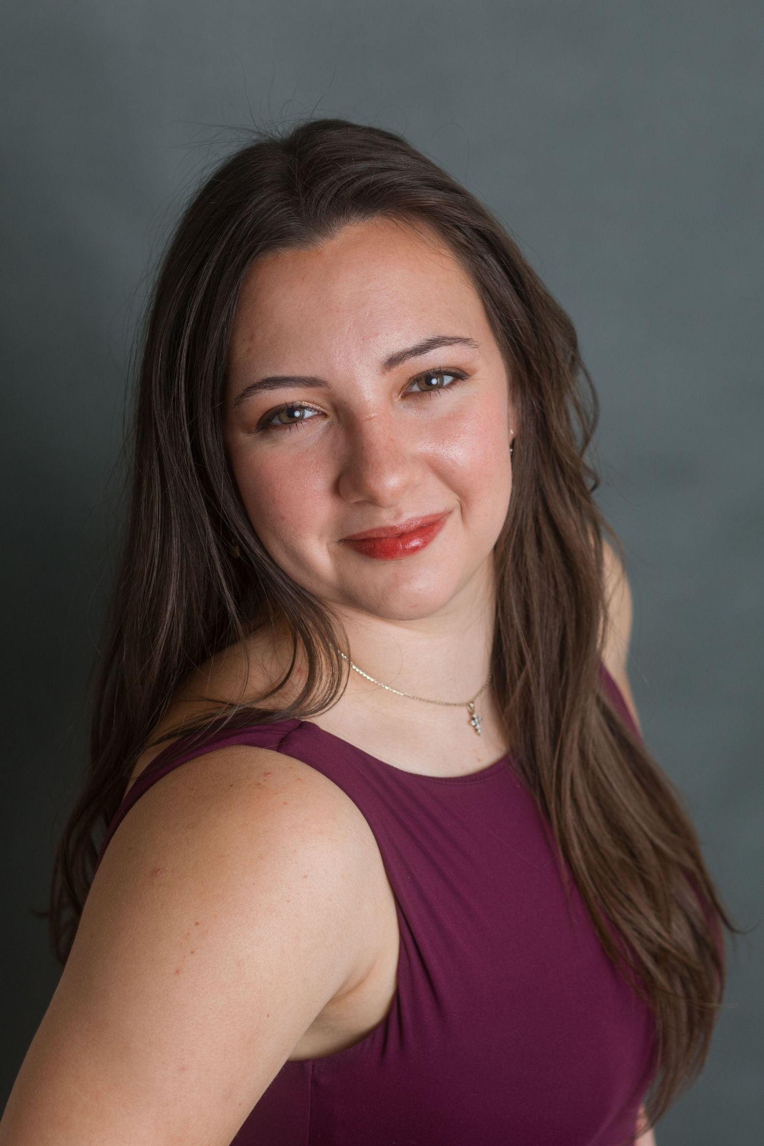Studio headshot of young woman with natural smile and soft lighting, Boise Idaho photographer