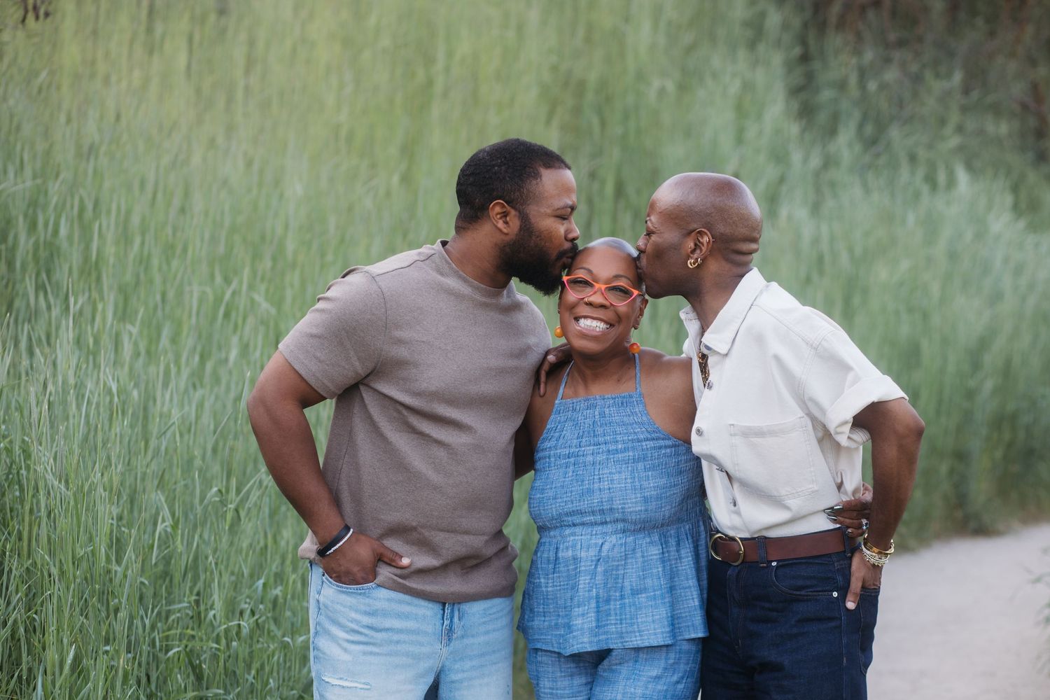 Mother smiling with adult sons during an extended family photography session at Camel’s Back Park in Boise.