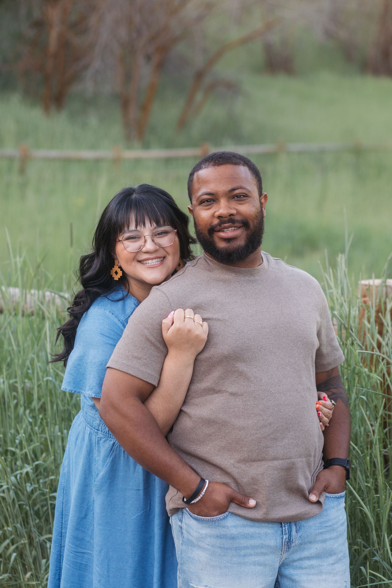 Husband and wife posing together outdoors at Camel’s Back Park during an extended family session.