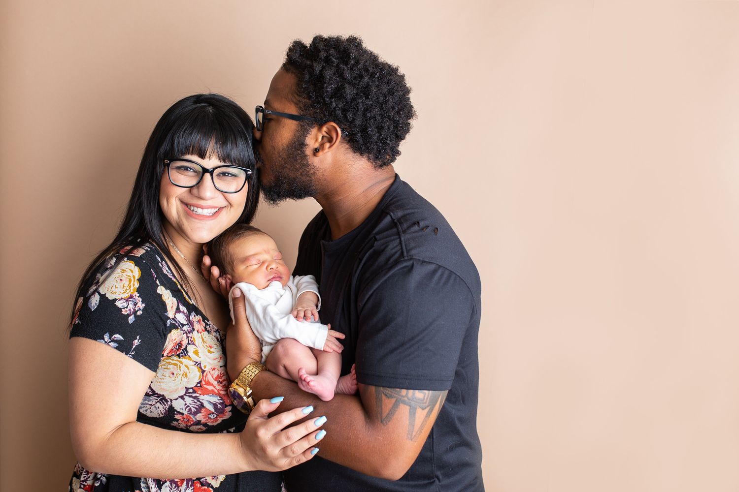 intimate family photos showing tender moments between parents and their newborn baby studio newborn photography Nampa Idaho