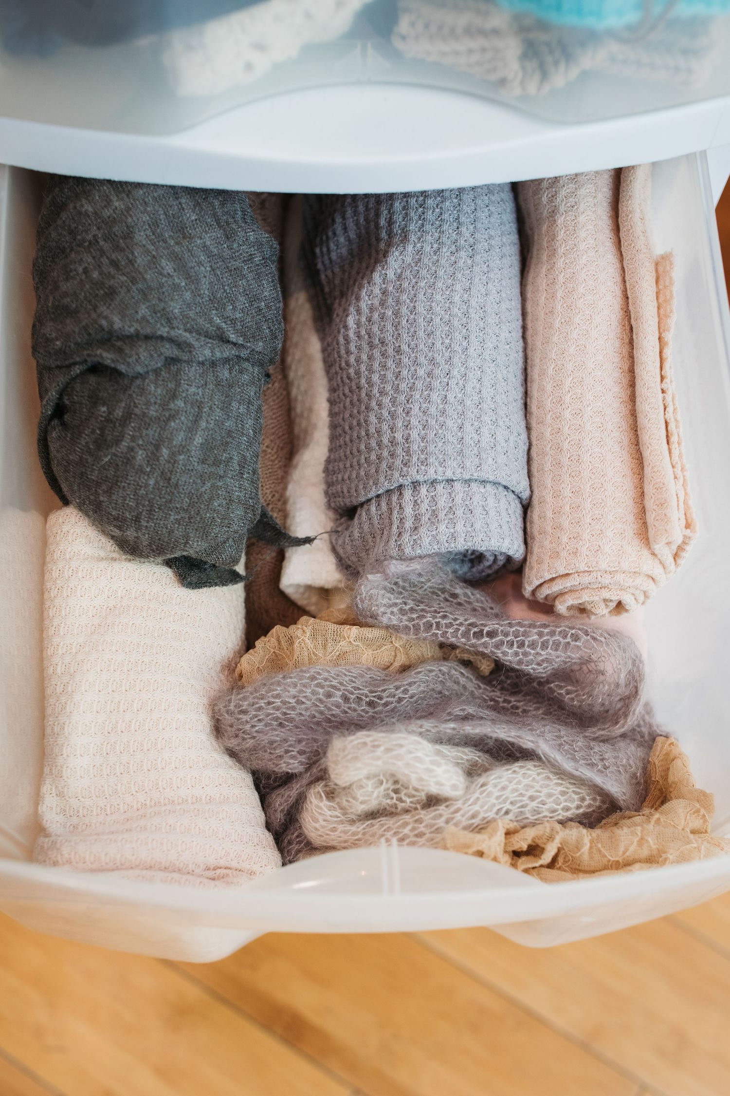 Neutral newborn wraps and textured fabrics for timeless baby portraits.