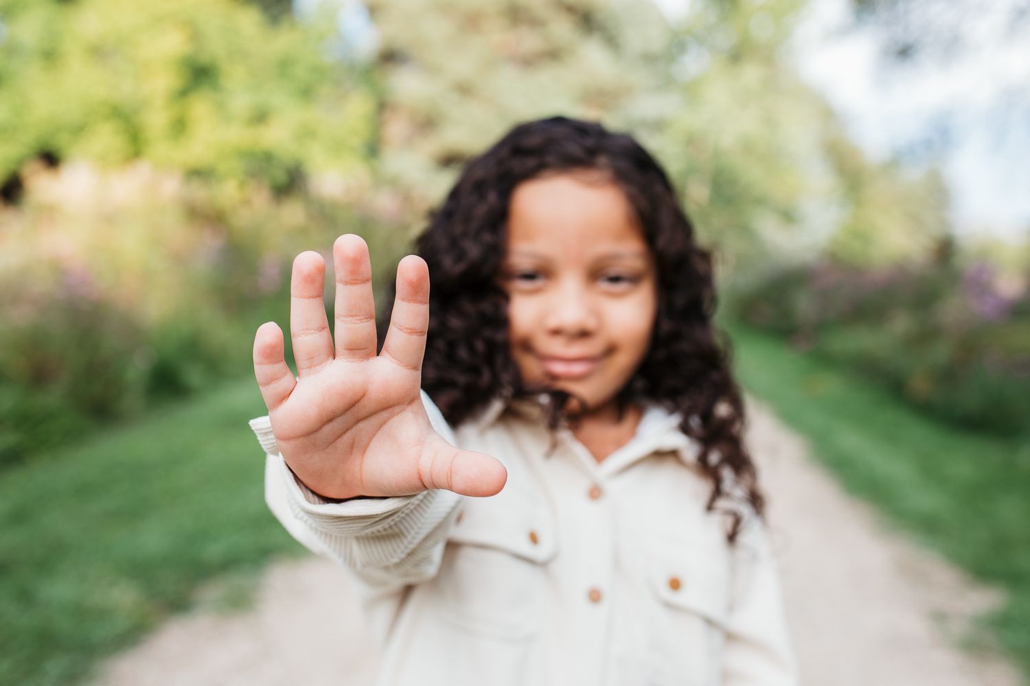 a boy holding 5 fingers out on his hand - birthday milestone photos Boise Idaho