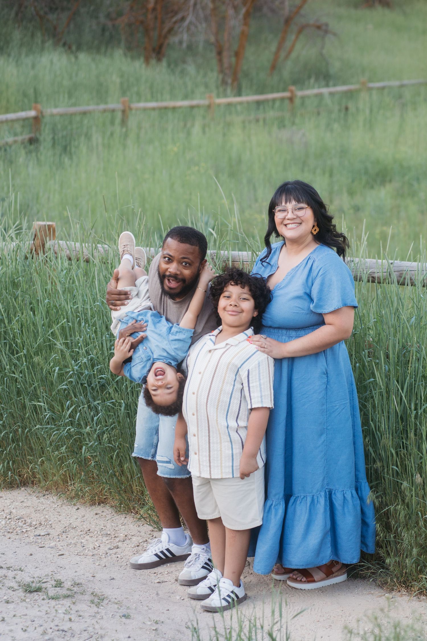 Family of four posing together at Camel’s Back Park during a spring family photography session in Boise.