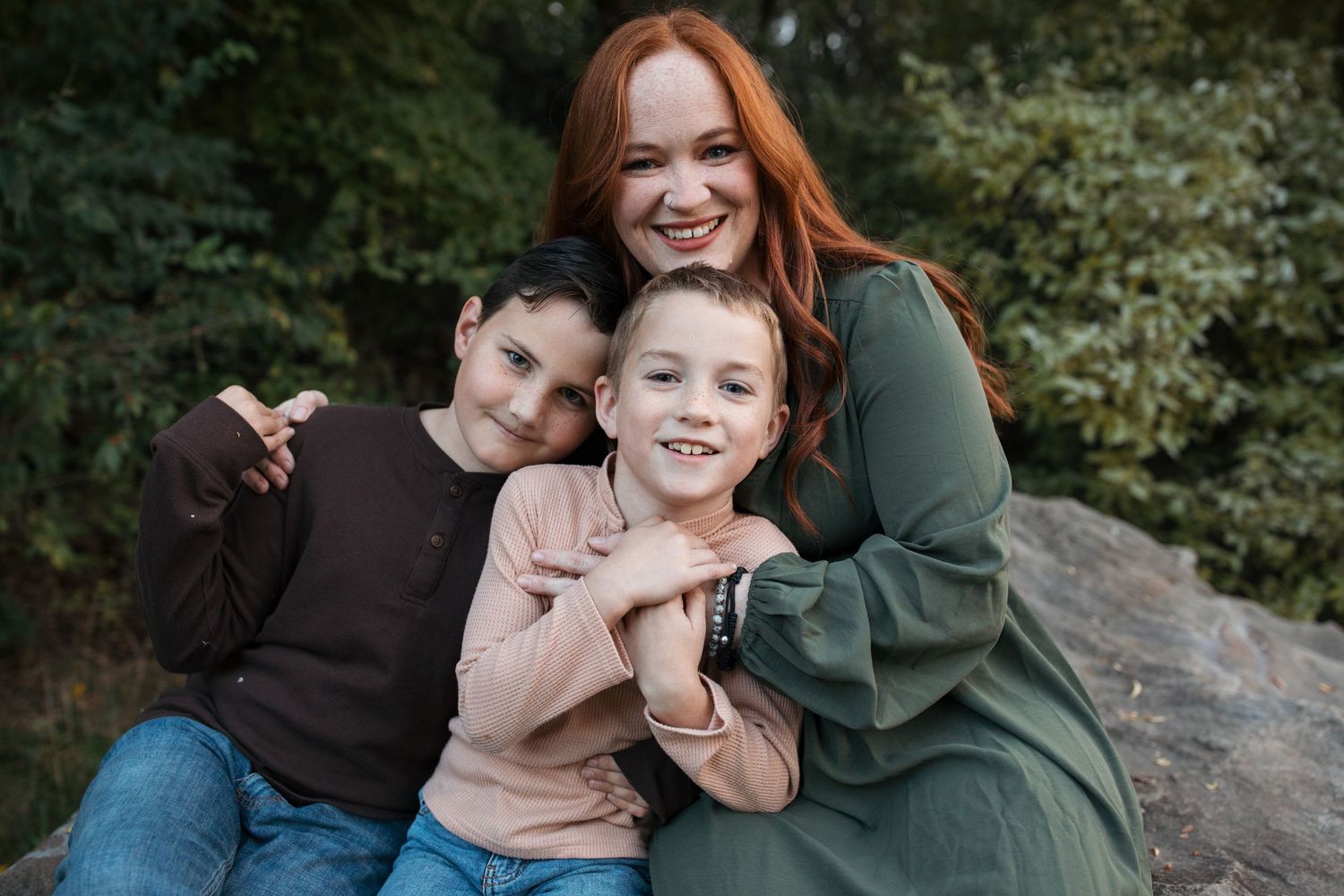Mom surrounded by her children during a lifestyle family session in Boise, Idaho.