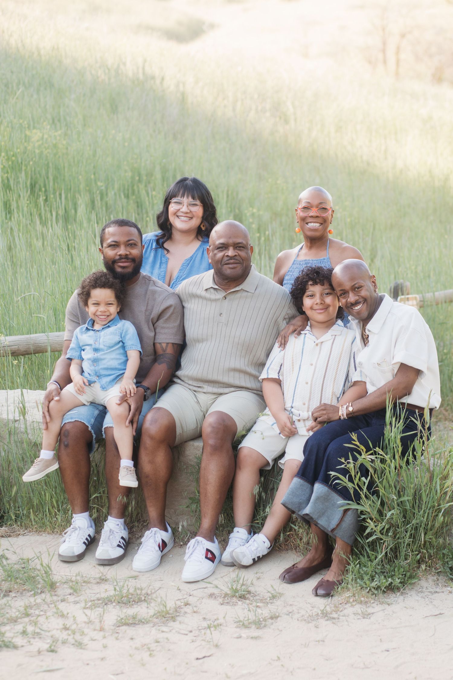 Extended family sitting together at Camel’s Back Park in Boise during a spring Mother’s Day family photography session.
