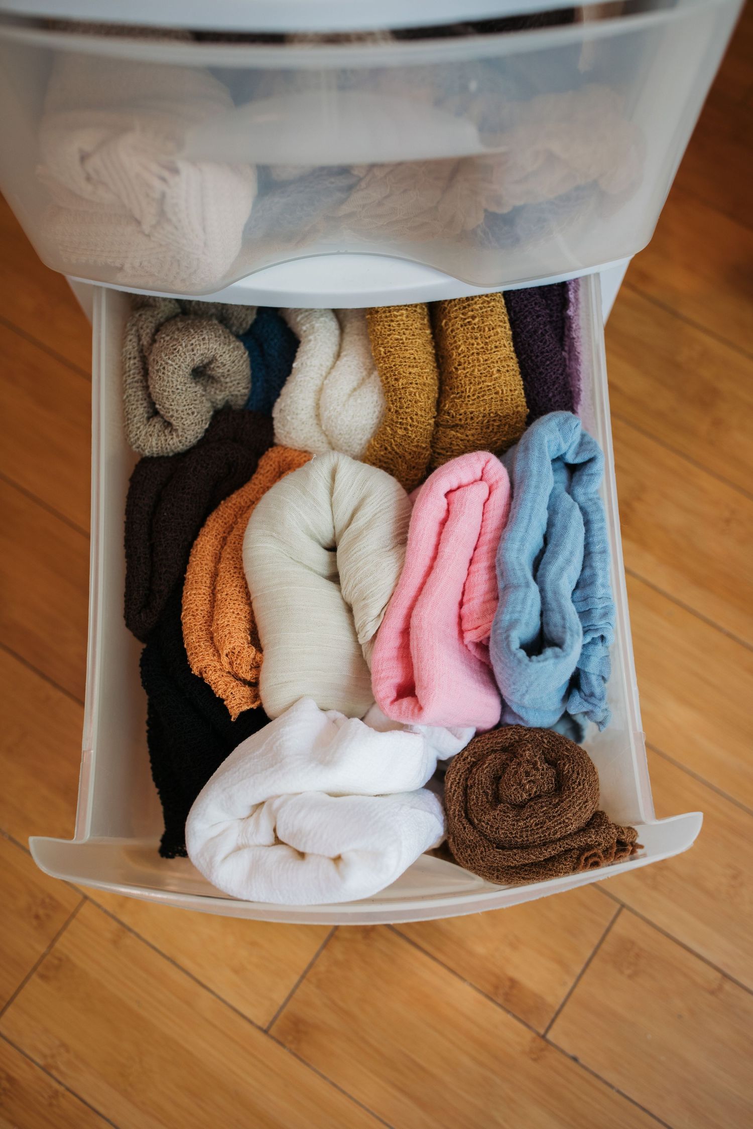 Collection of soft newborn wraps in a variety of colors for studio photography.