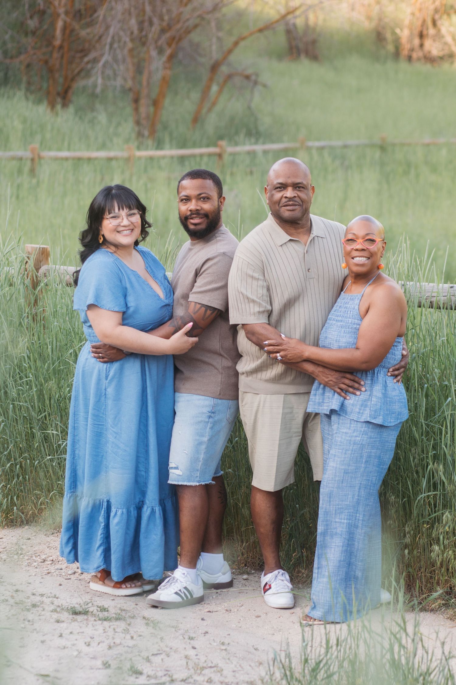 Son and daughter-in-law posing with parents during an extended family session at Camel’s Back Park in Boise.