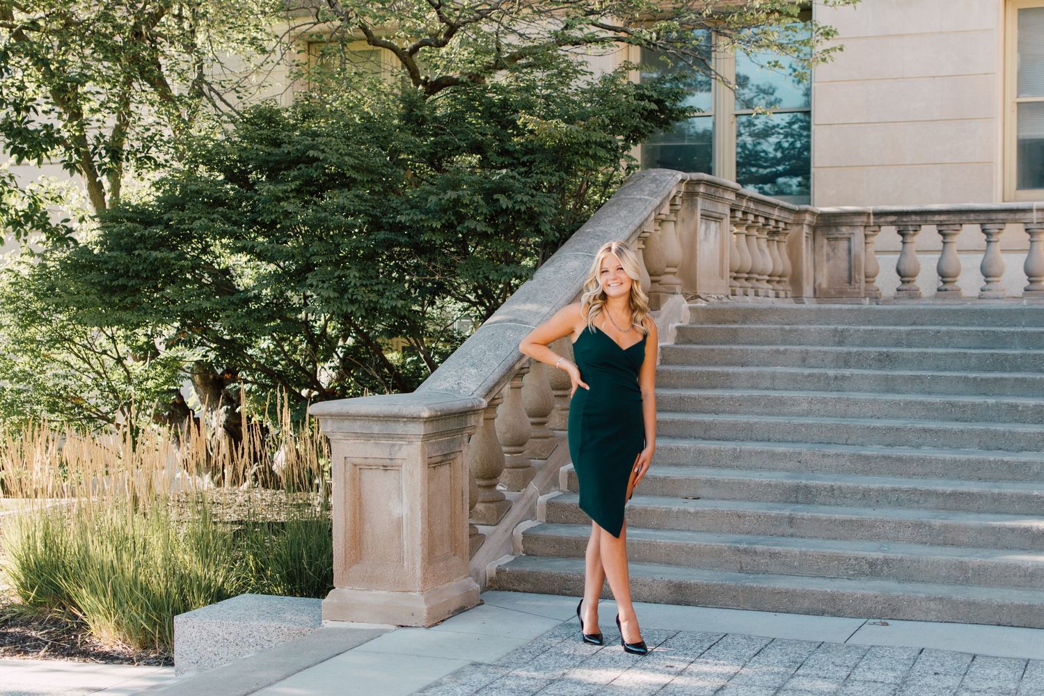 Urban photoshoot on grand stone staircase in black athletic wear.