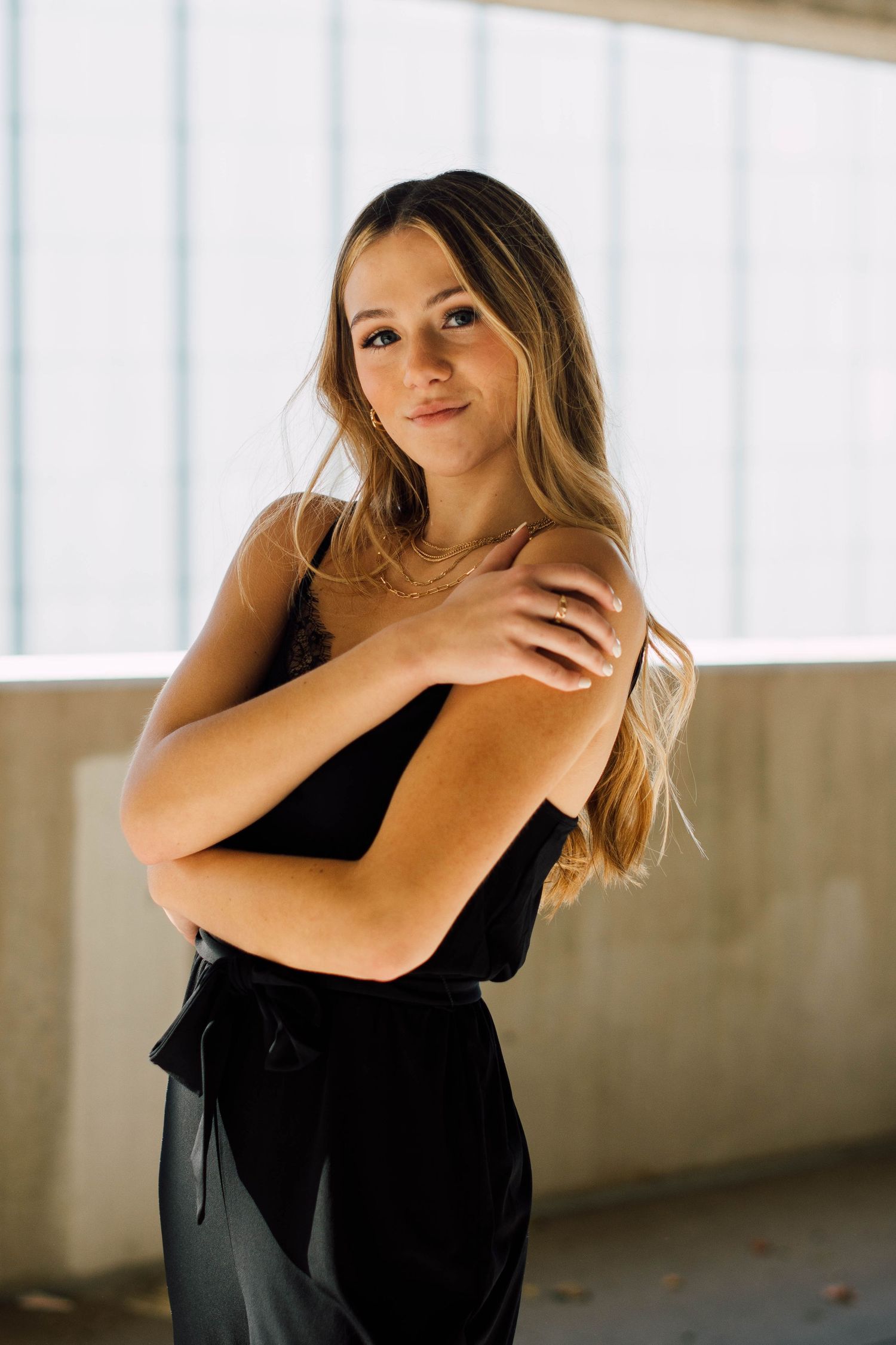 Artistic portrait series in a black dress showing elegant movement and expression.