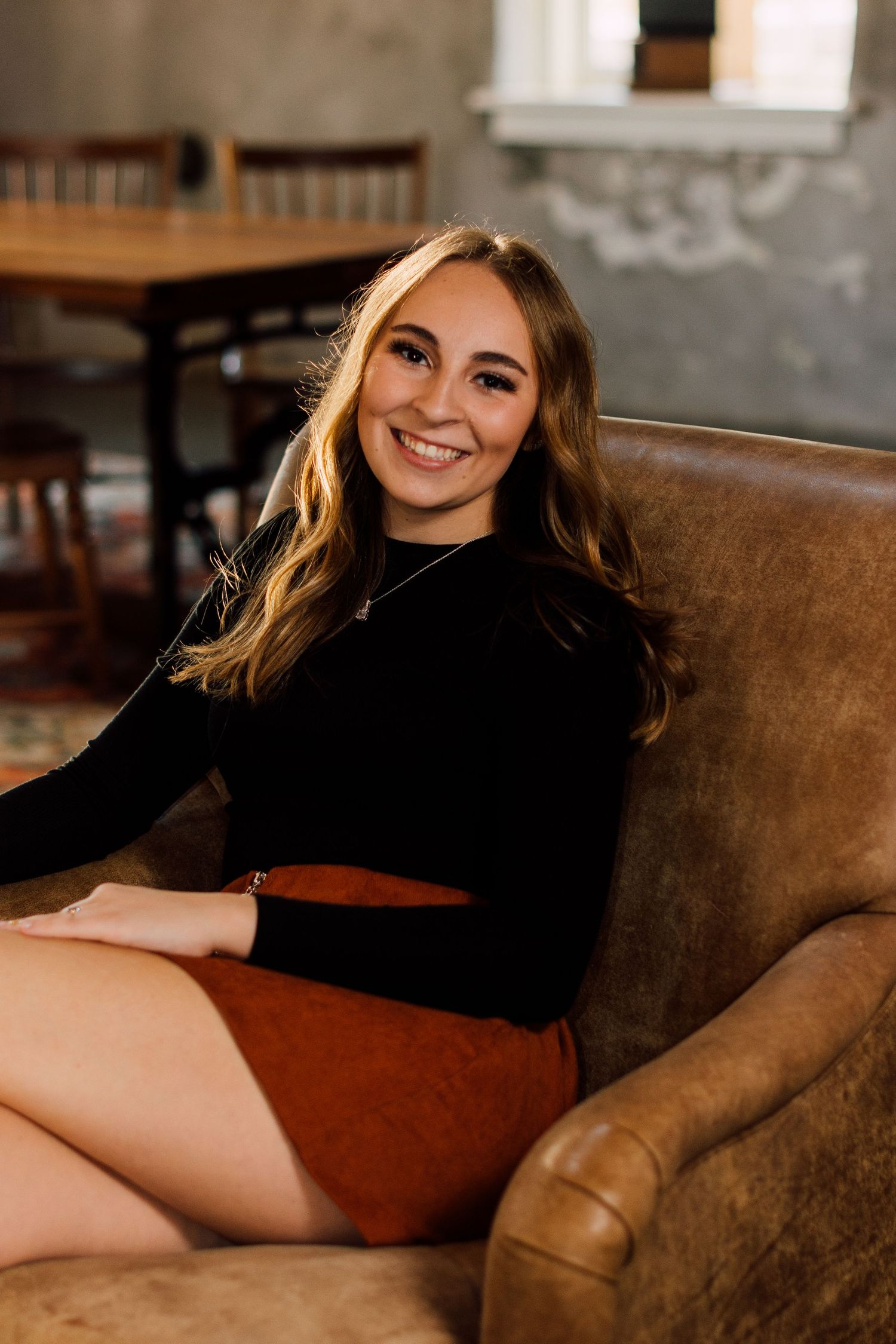 Lifestyle photos on a brown leather couch showing casual poses and expressions.