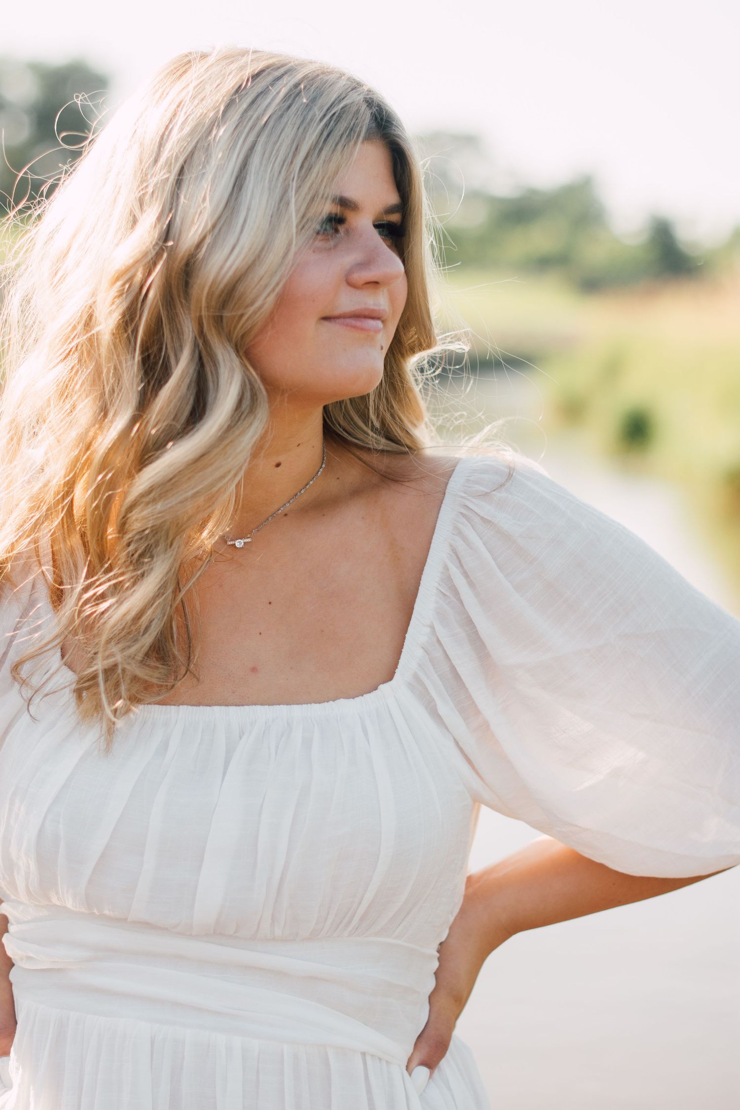 Dreamy outdoor portraits in a white peasant dress during sunset.