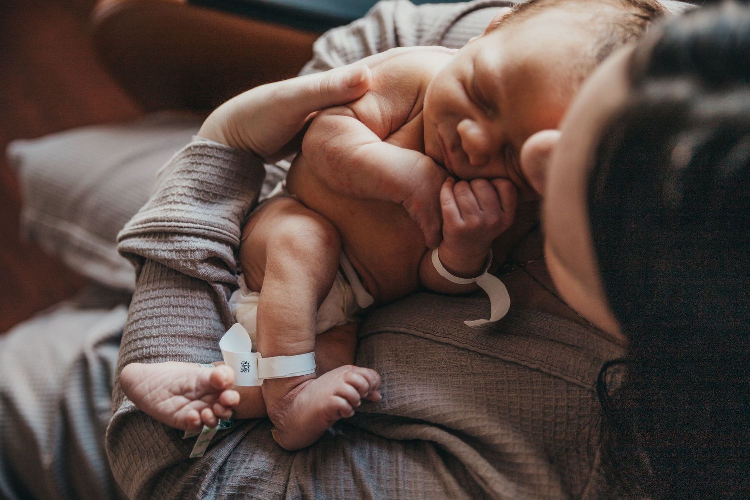 Union Hospital Terre Haute Newborn baby Photos. Close-up of hands giving an injection with a syringe during medical treatment. mother