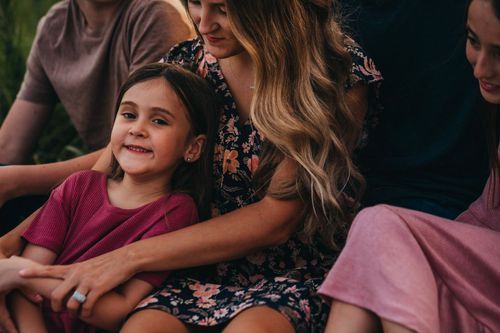 A candid moment of laughter and joy among family members sitting together. Family photos parke county