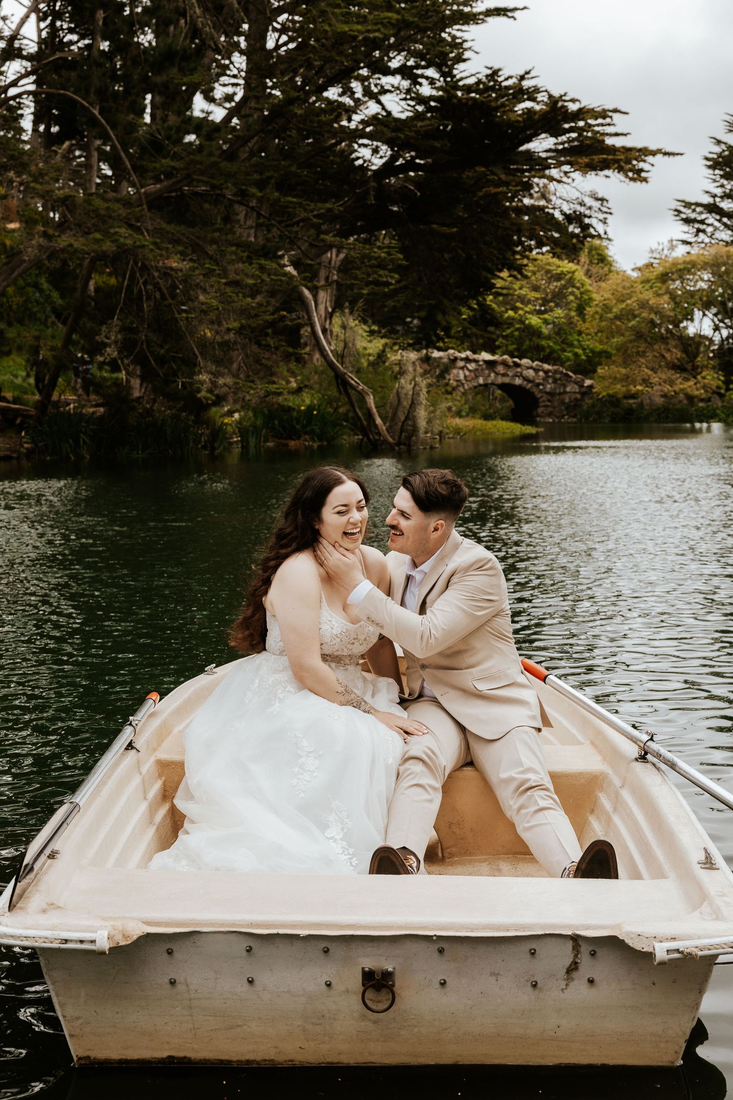 San Francisco elopement - a couple is on a romantic row boat in golden gate park