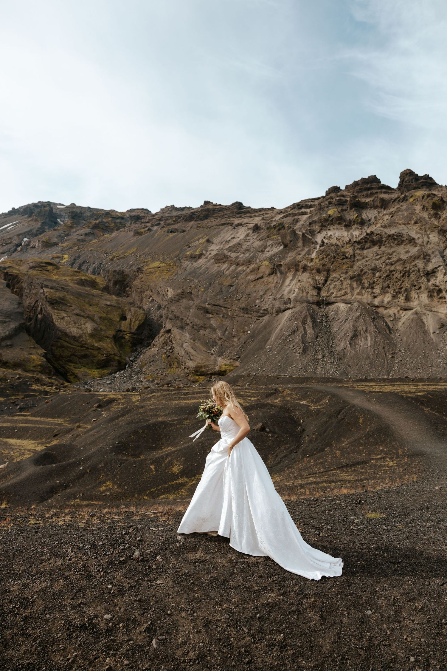 bride walking on a mountain in Iceland